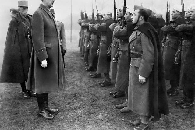'Charles de Gaulle, Chief of the French Free Forces, inspects the French colonial troops during during his visit of a military base in Great Britain, 1941'