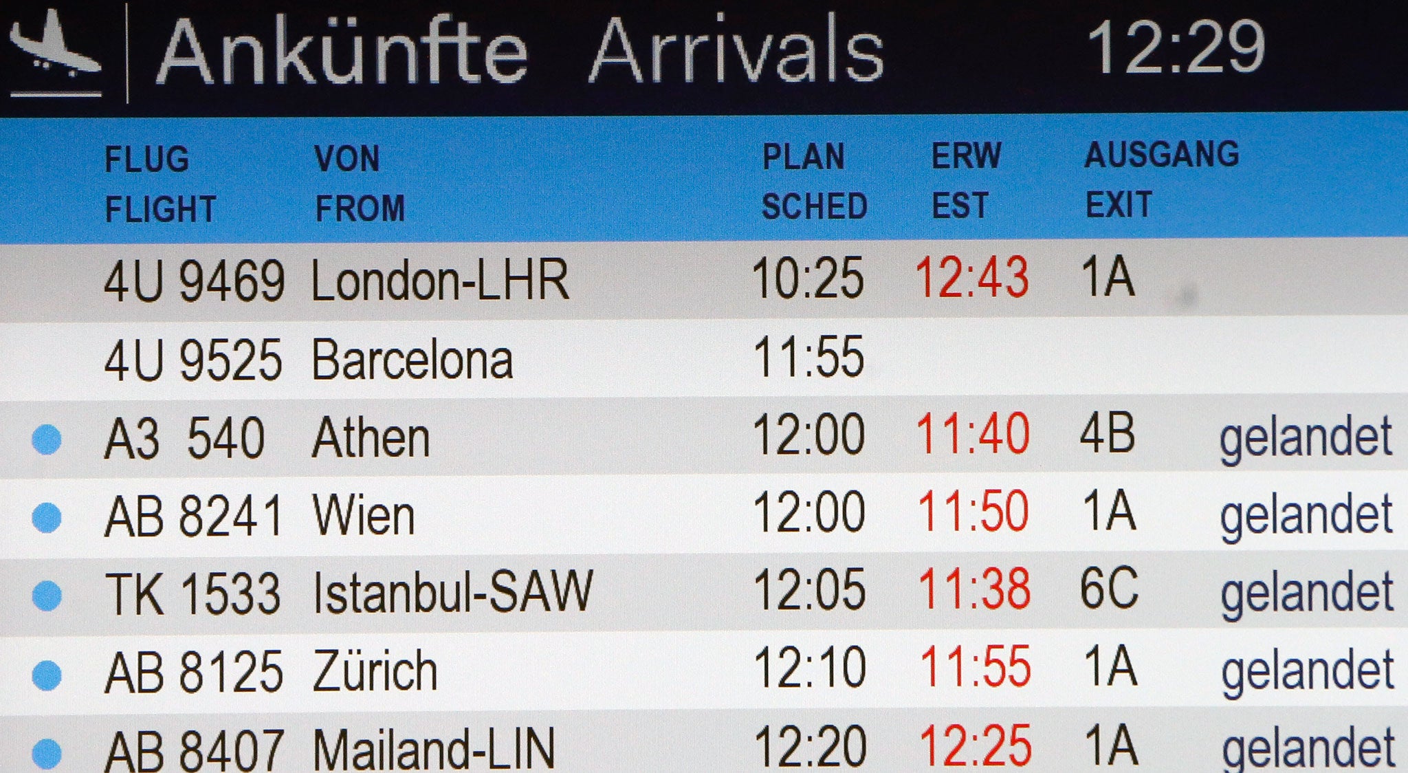 The arrivals board shows flight 4U 9525 without a status at the airport in Duesseldorf, Germany