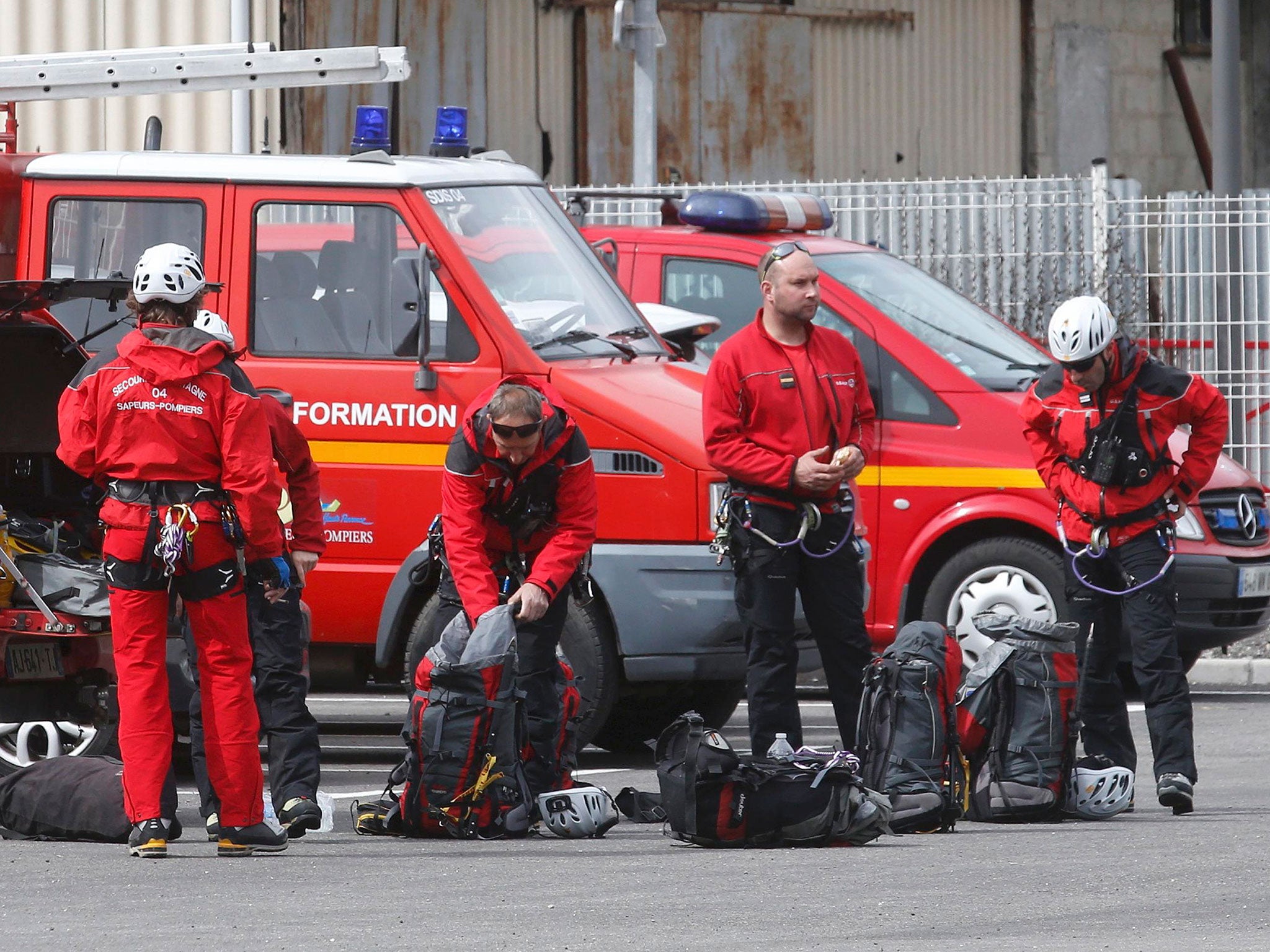 French firefighters prepare to take-off in Digne-les-Bains for the crash site of an Airbus A320, in the French Alps