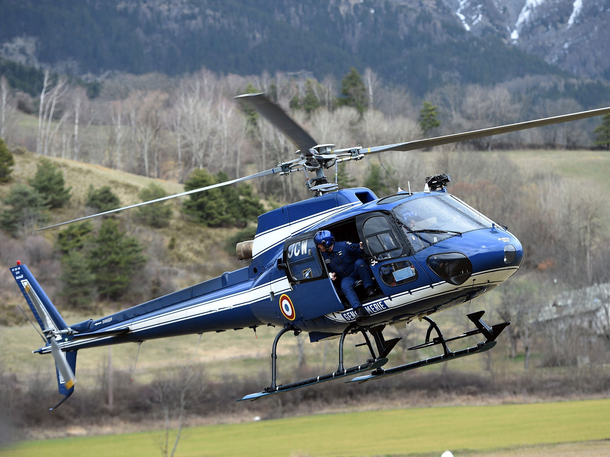 A helicopter of the French National Gendarmerie is seen in Seyne, south-eastern France, near the site where a Germanwings Airbus A320 crashed in the French Alps