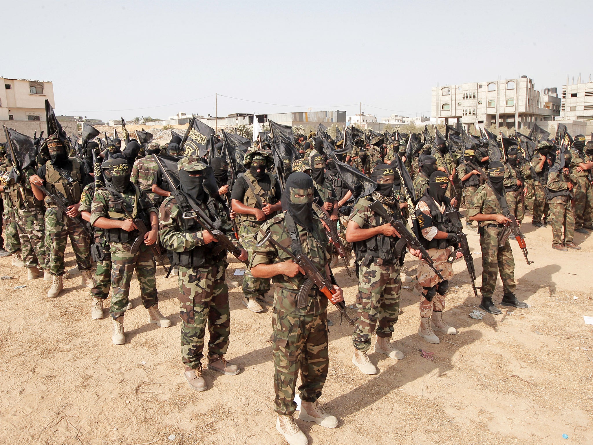 Palestinian Islamic Jihad militants mark the 25th anniversary of the Islamist movement's establishment in Rafah in the southern Gaza Strip, in 2012