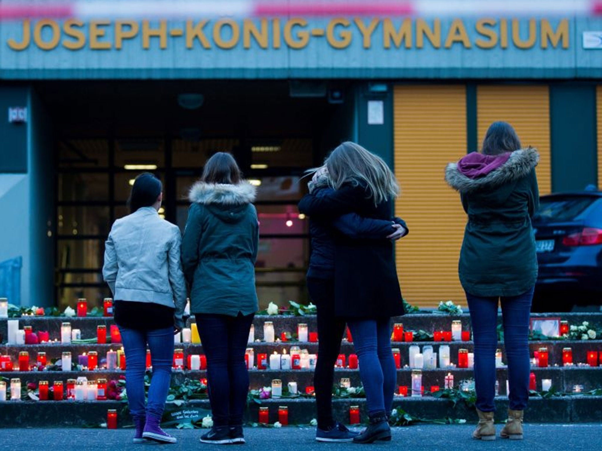 Students leave candles in front of the Joseph-Koenig college in Haltern am See (Image: EPA/Rolf Vennenbernd)