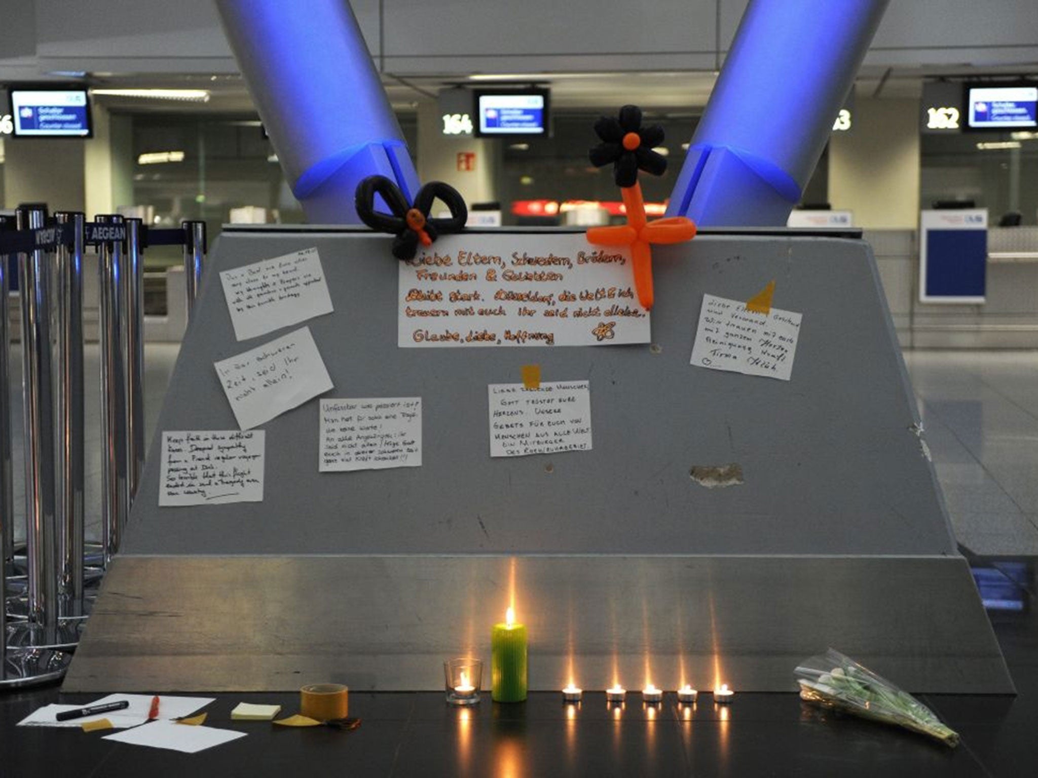 Candles and condolence messages are seen in Duesseldorf airport, Germany (Image: EPA/CAROLINE SEIDEL)