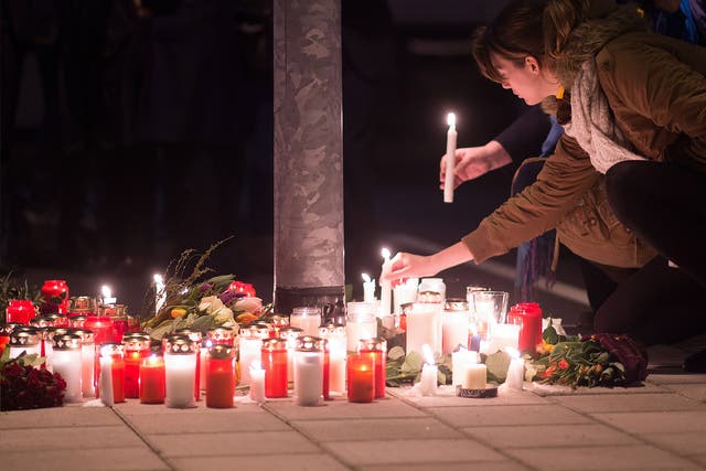 Staff members of Germanwings and Lufthansa hold a candlelight vigil outside the headquarters of Germanwings in Cologne
