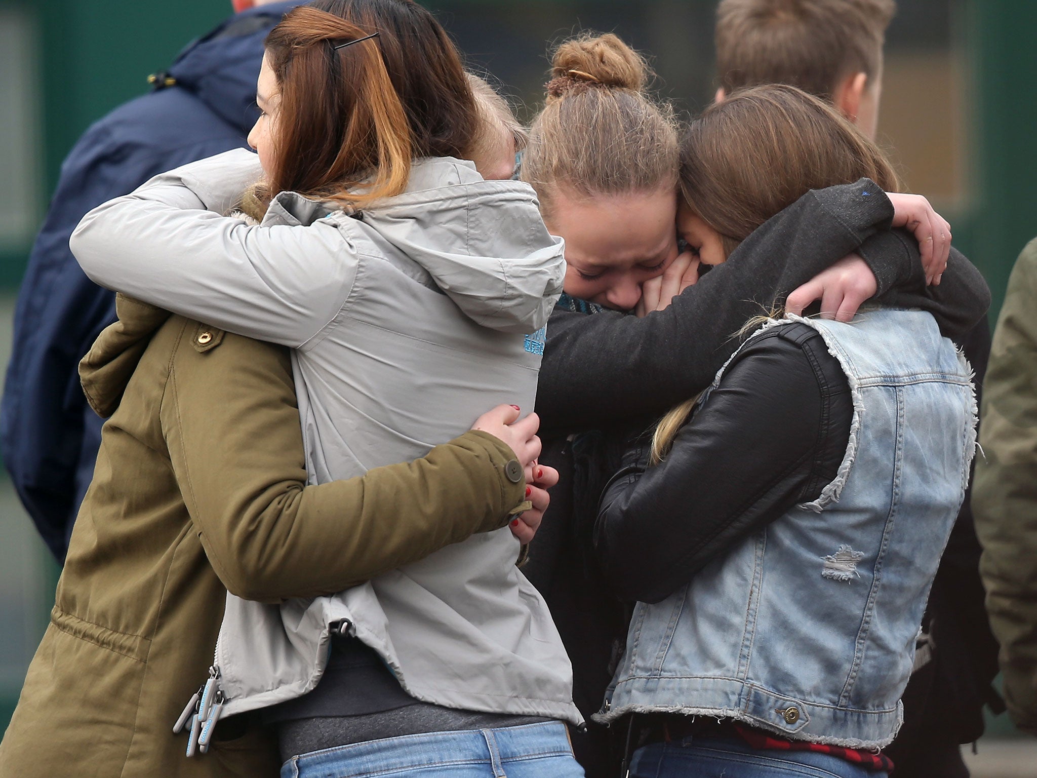 Pupils gather at the Joseph-Koenig-Gymnasium high school to pay tribute to 16 students and two teachers from the school who were on Germanwings flight 4U9525 that crashed yesterday in southern France in Haltern, Germany