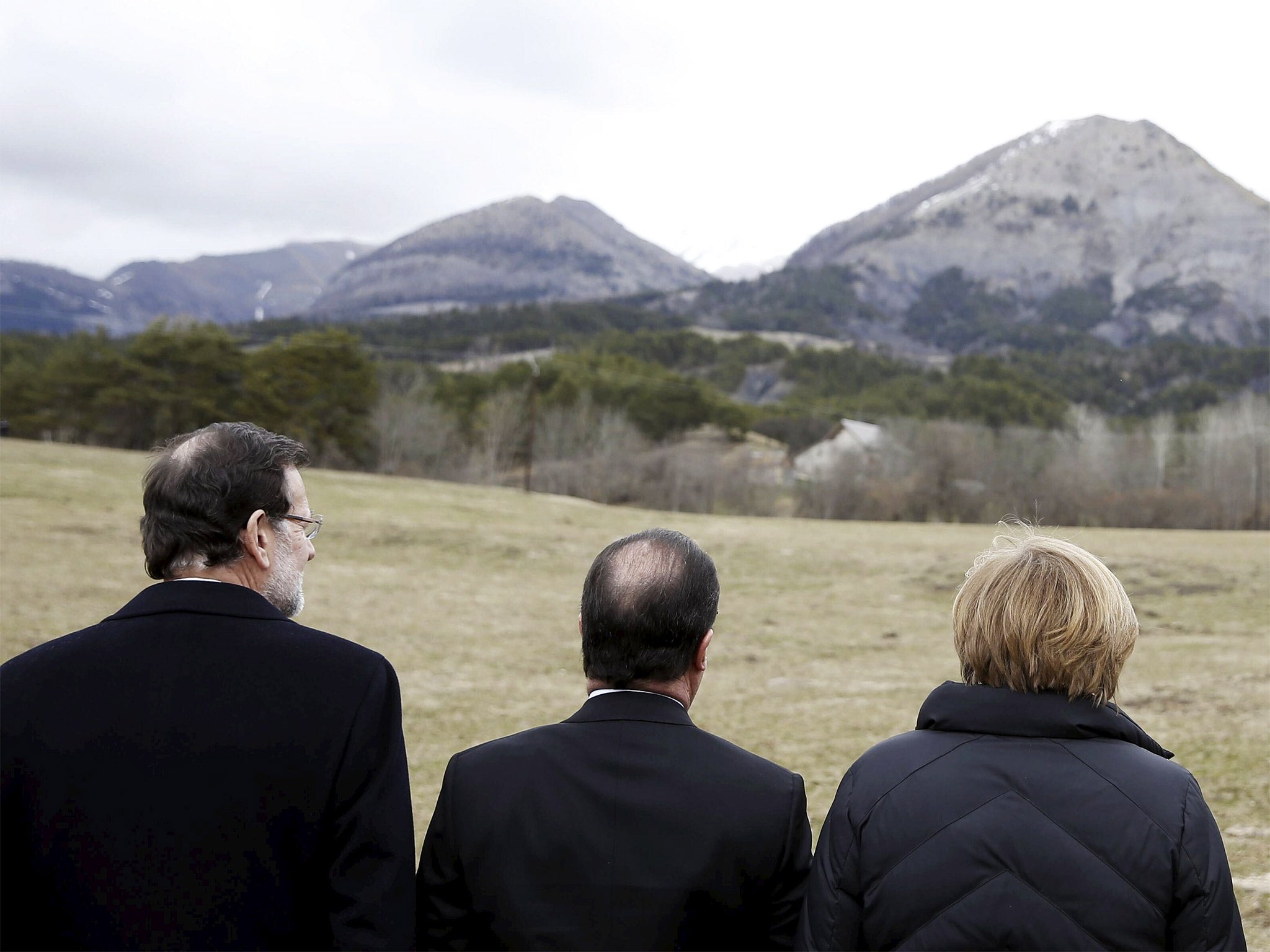 Spain’s Prime Minister, Mariano Rajoy, France’s President François Hollande and the German Chancellor Angela Merkel near the crash site