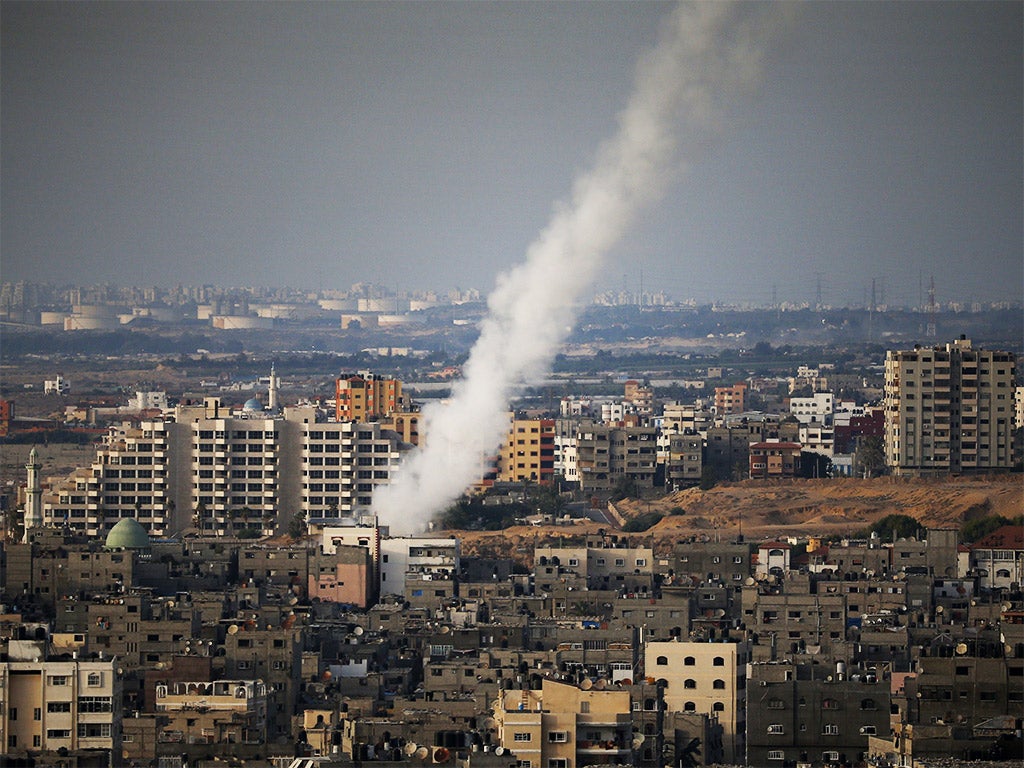 A long-range rocket is launched from the north of Gaza City towards Israel (Getty)