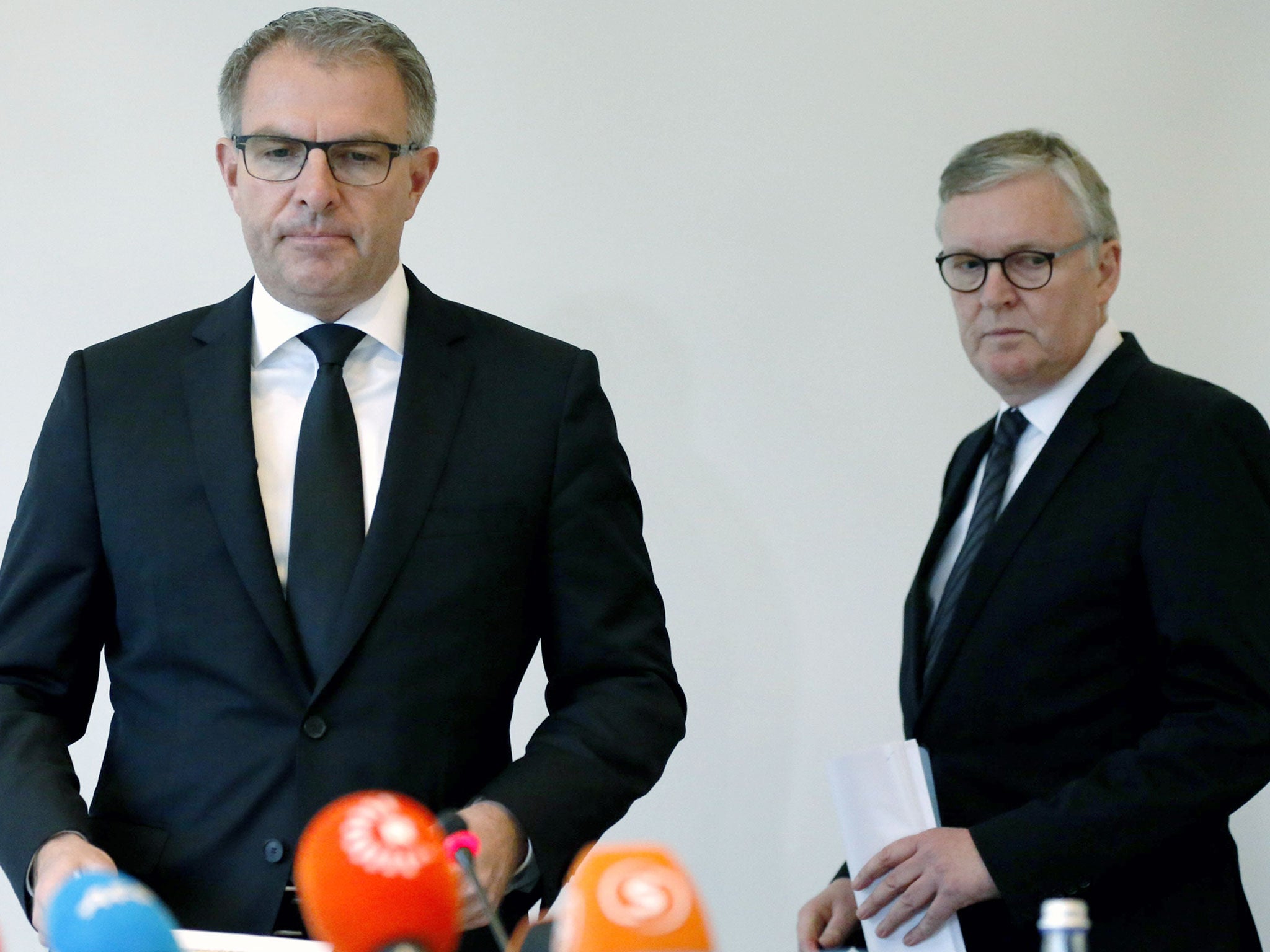 Lufthansa CEO Carsten Spohr, left, and Germanwings CEO Thomas Winkelmann arrive for a press conference near the Germanwings headquarters in Cologne, Germany