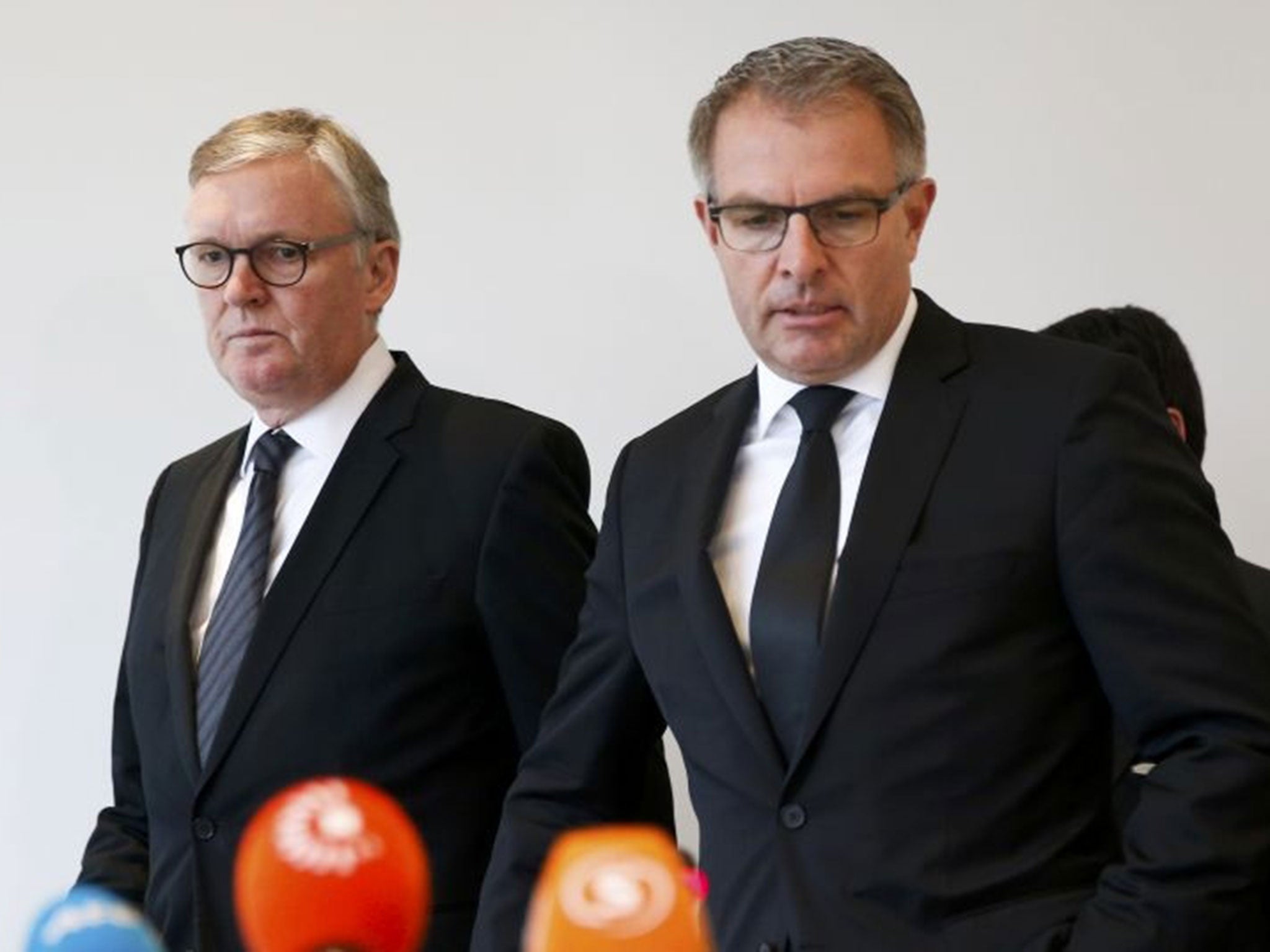 Lufthansa Chief Executive Carsten Spohr and Germanwings Managing Director Thomas Winkelmann (L) arrive for a news conference in Cologne Bonn airport