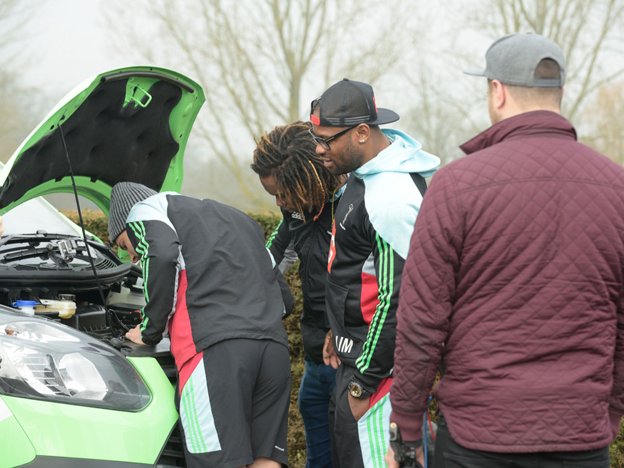 The Harlequins trio get to grips with the Green Flag van