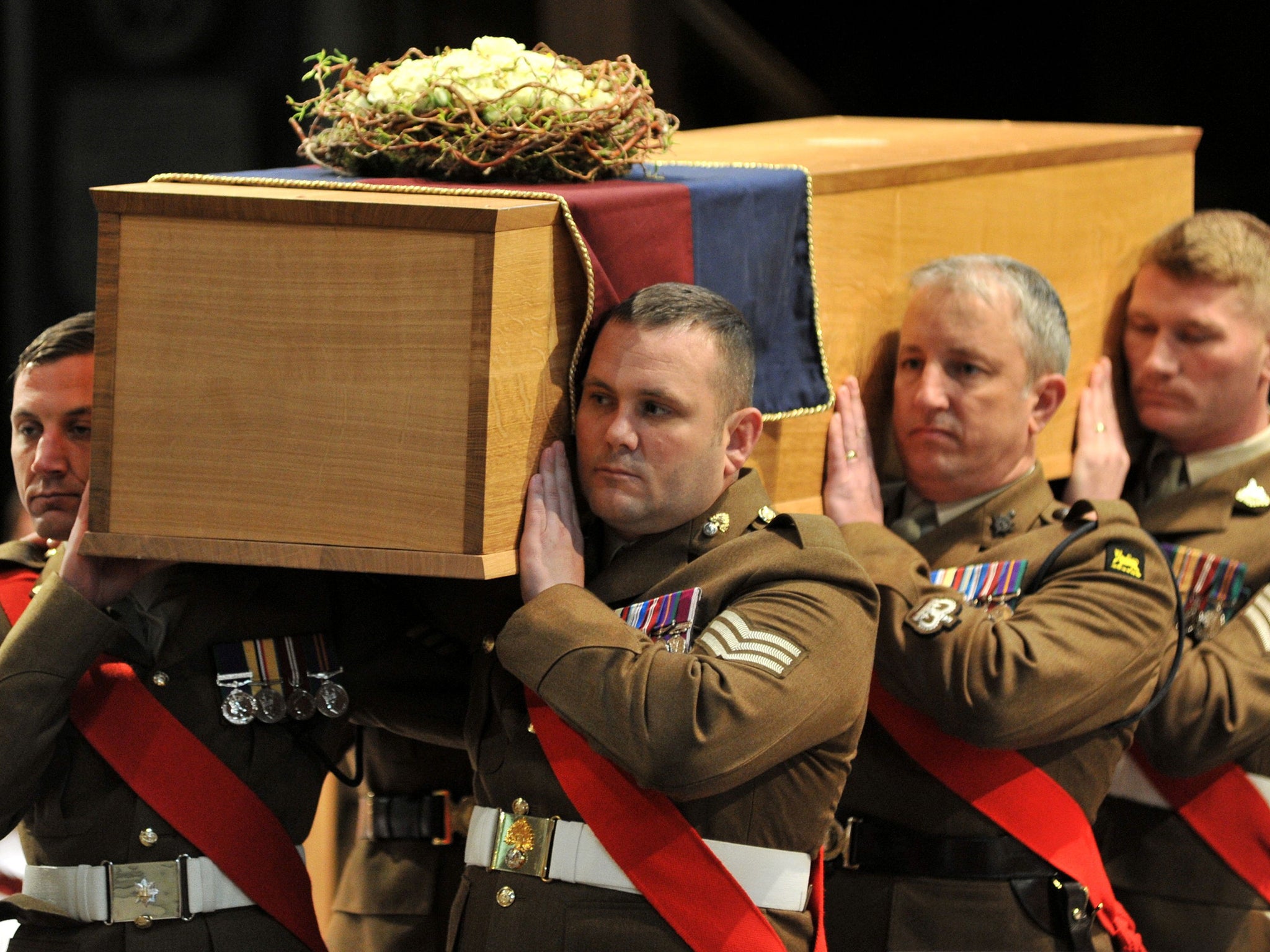 The coffin is carried by the military bearer party during the service for the re-burial of Richard III
