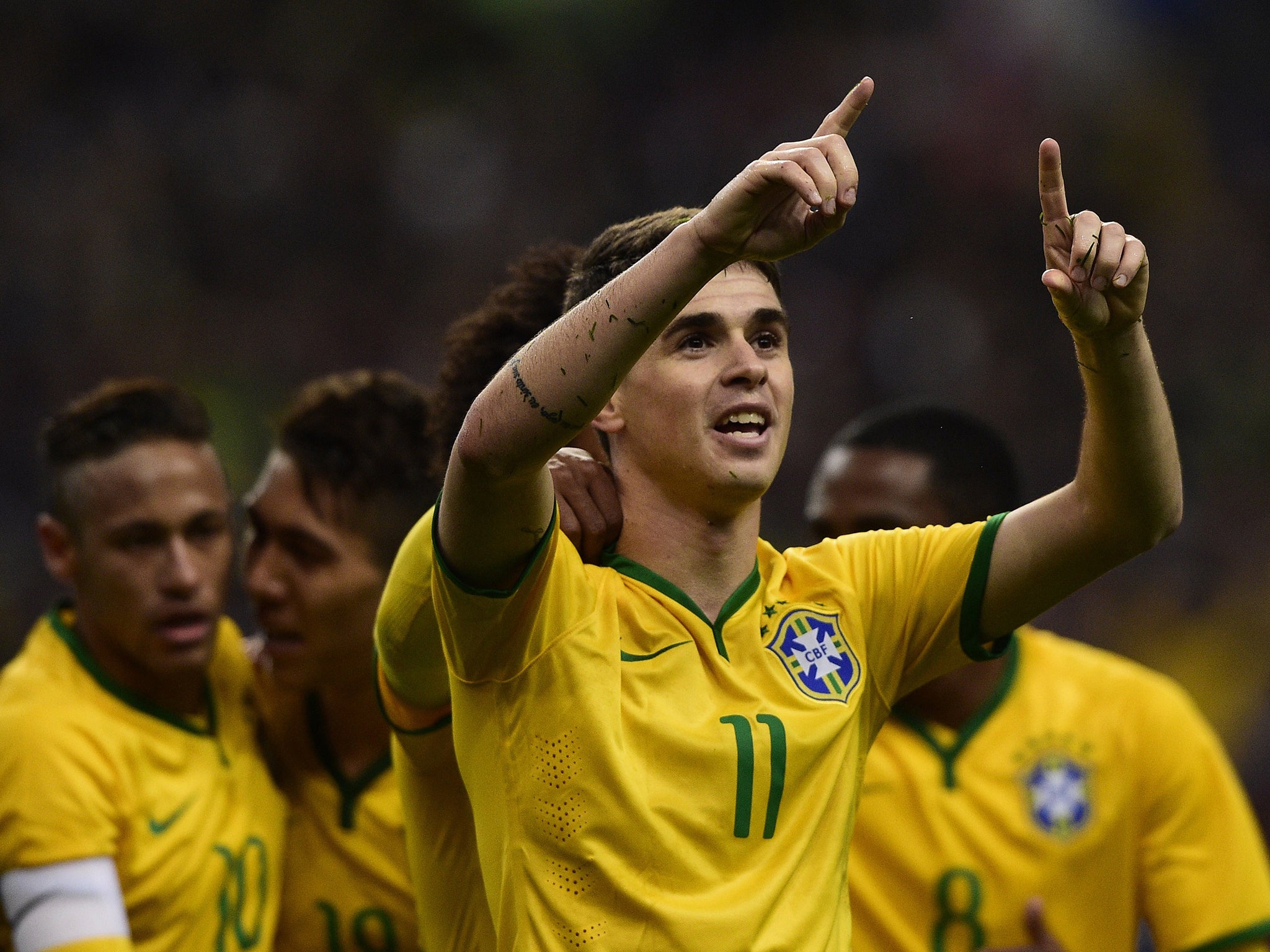 Oscar celebrates after scoring Brazil’s equaliser five minutes before half time last night