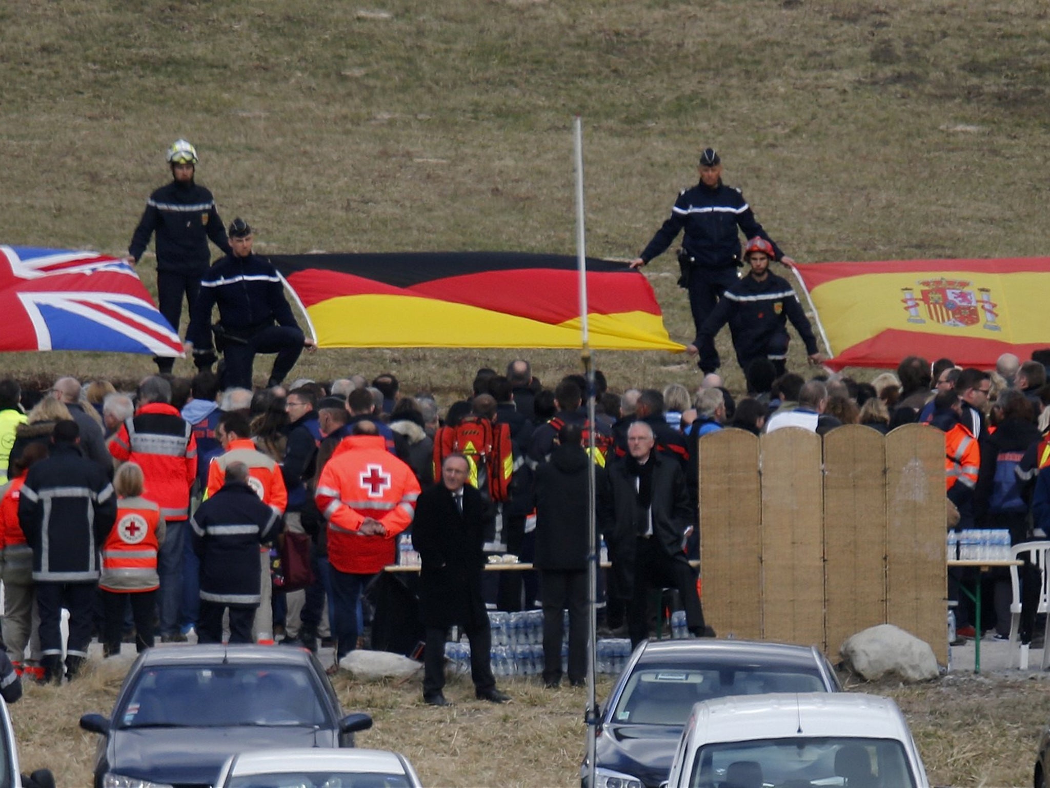 Flags symbolise the nationalities of victims as relatives
gather for a ceremony near the crash site