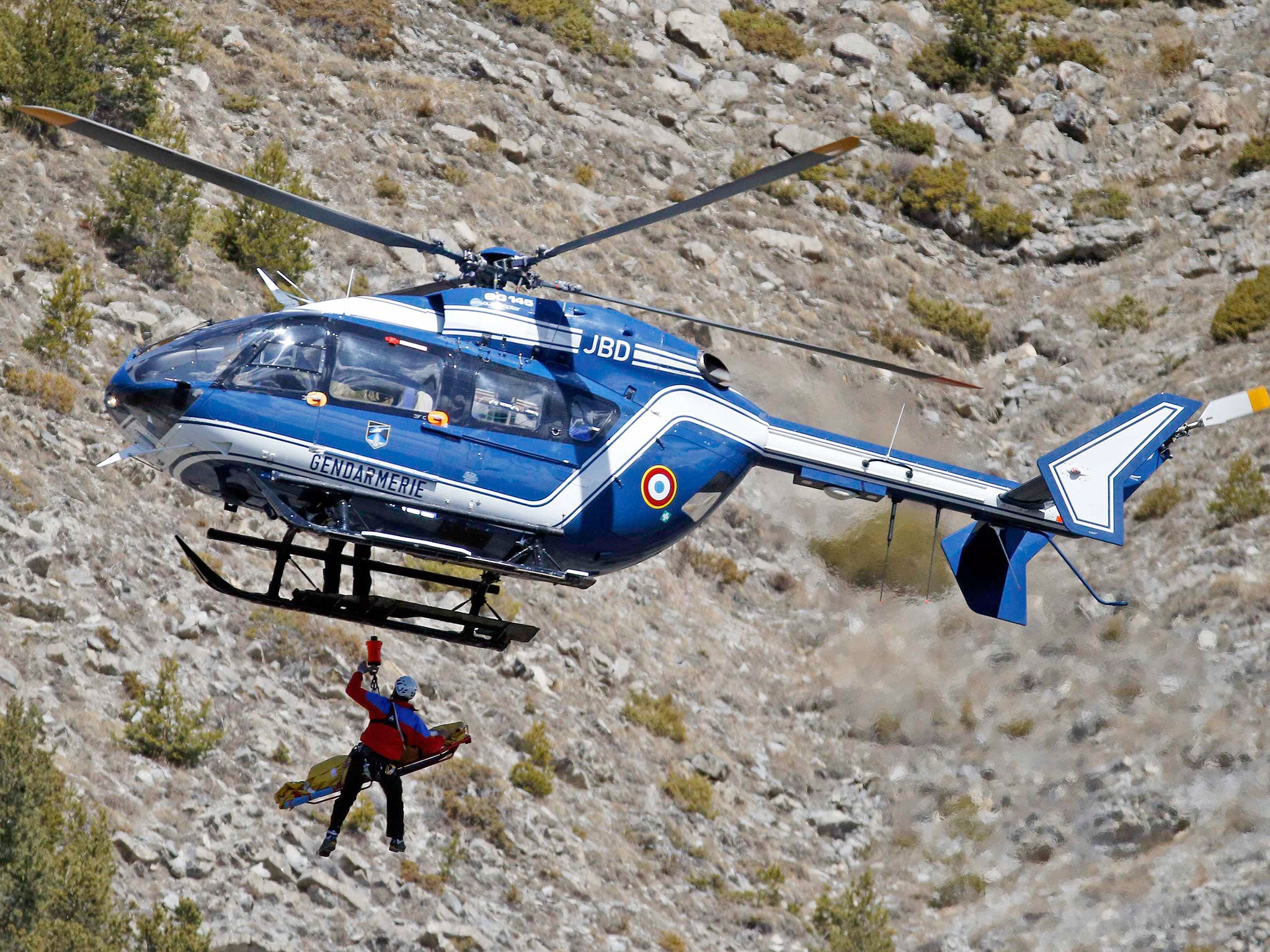 A body of a victim is evacuated by a French Gendarmerie rescue helicopter from the crash site