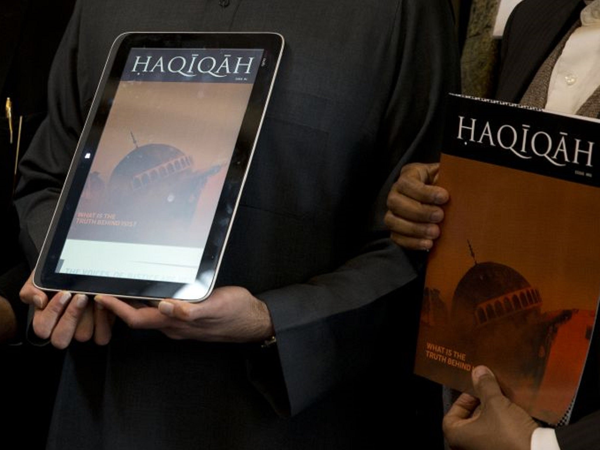 Haqiqah magazine being shown on the iPad and in print during the launch