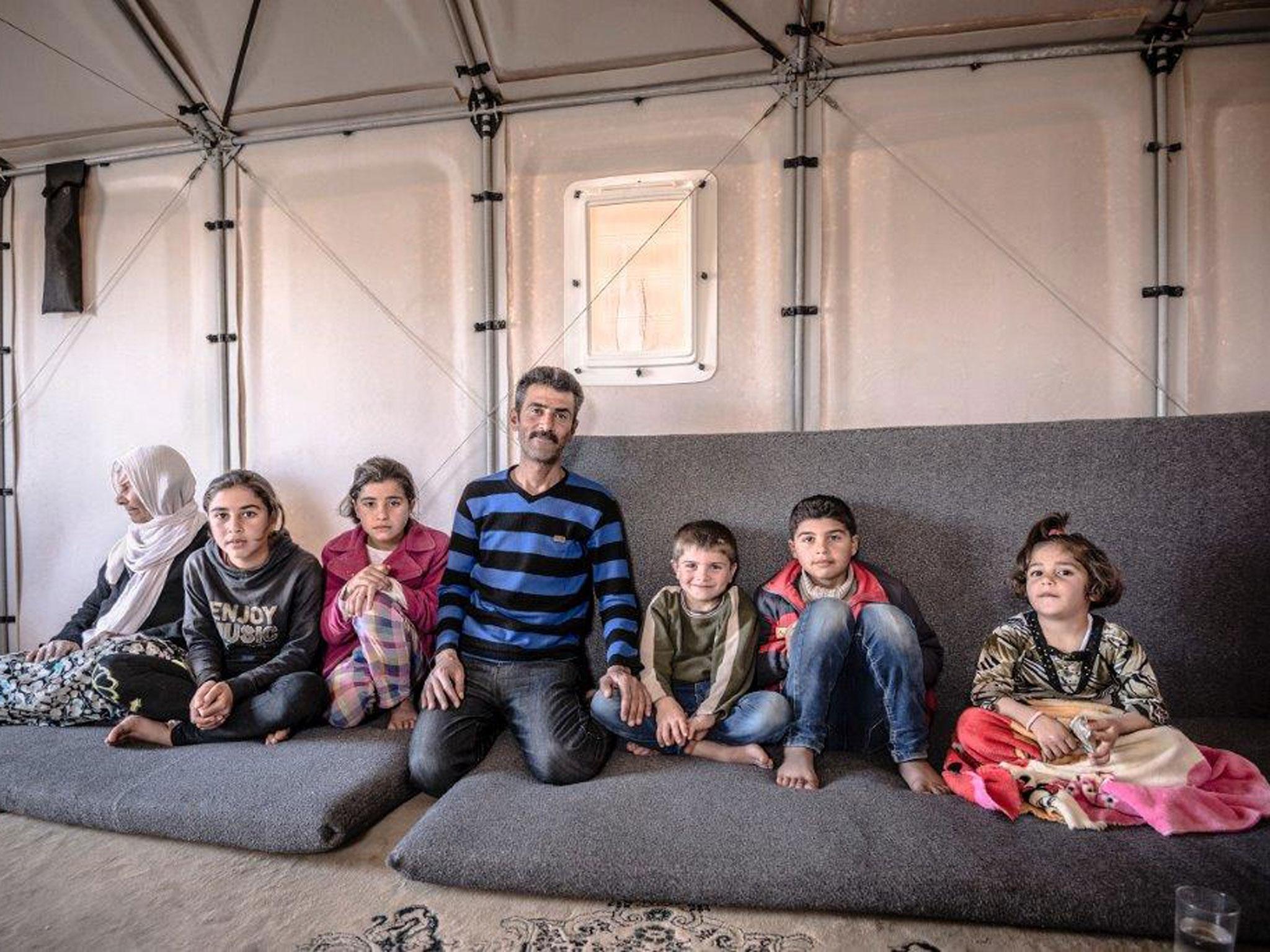 Riyad with sons, daughters and mother in law inside a Better Shelter prototype, Kawergosk refugee camp, Iraq, March 2015