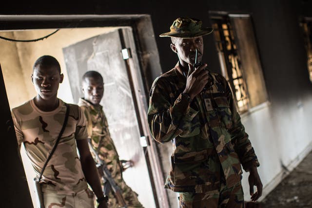 Nigerian troops inspect a former Boko Haram headquarters