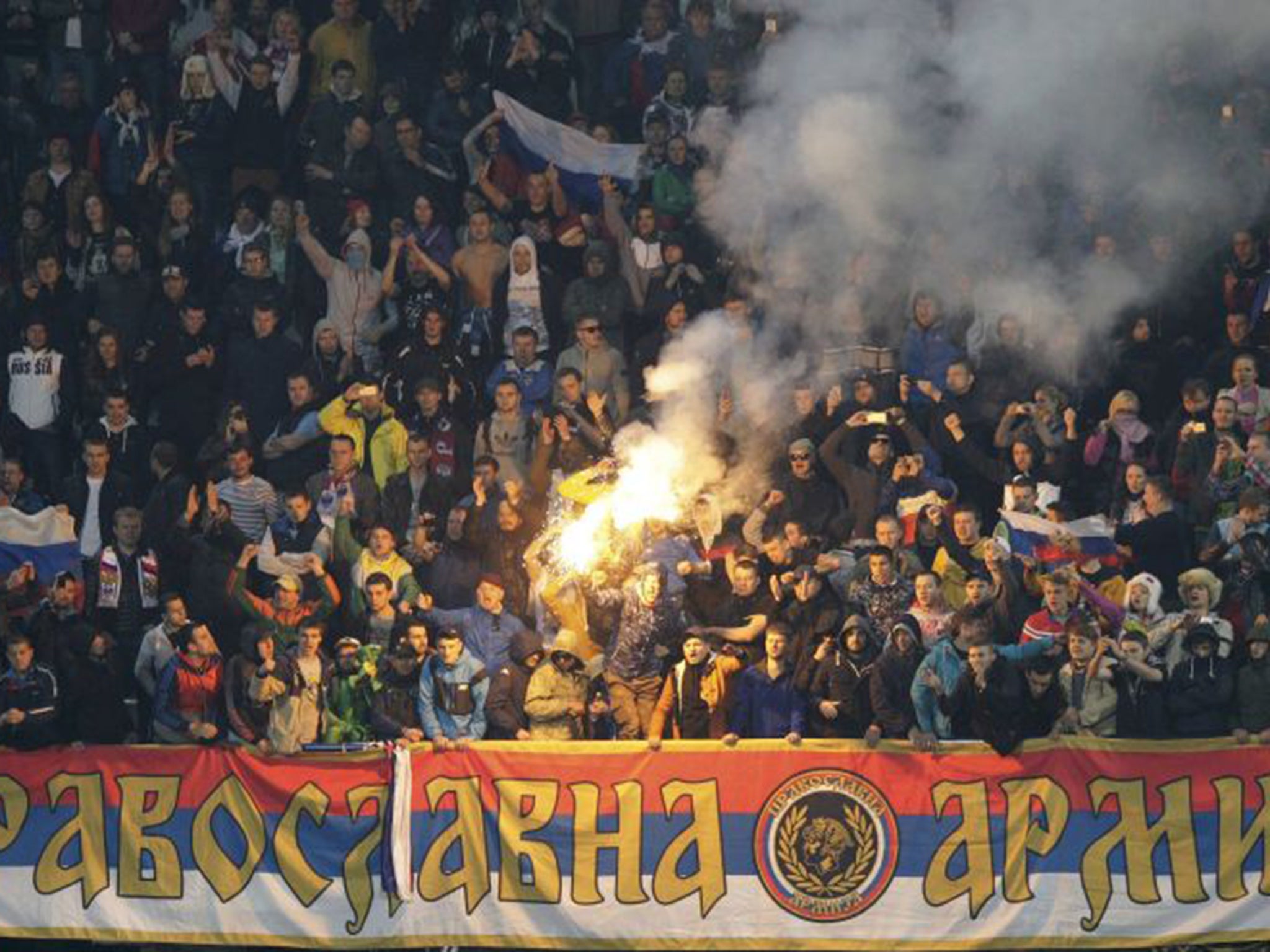 Russian fans light a flare