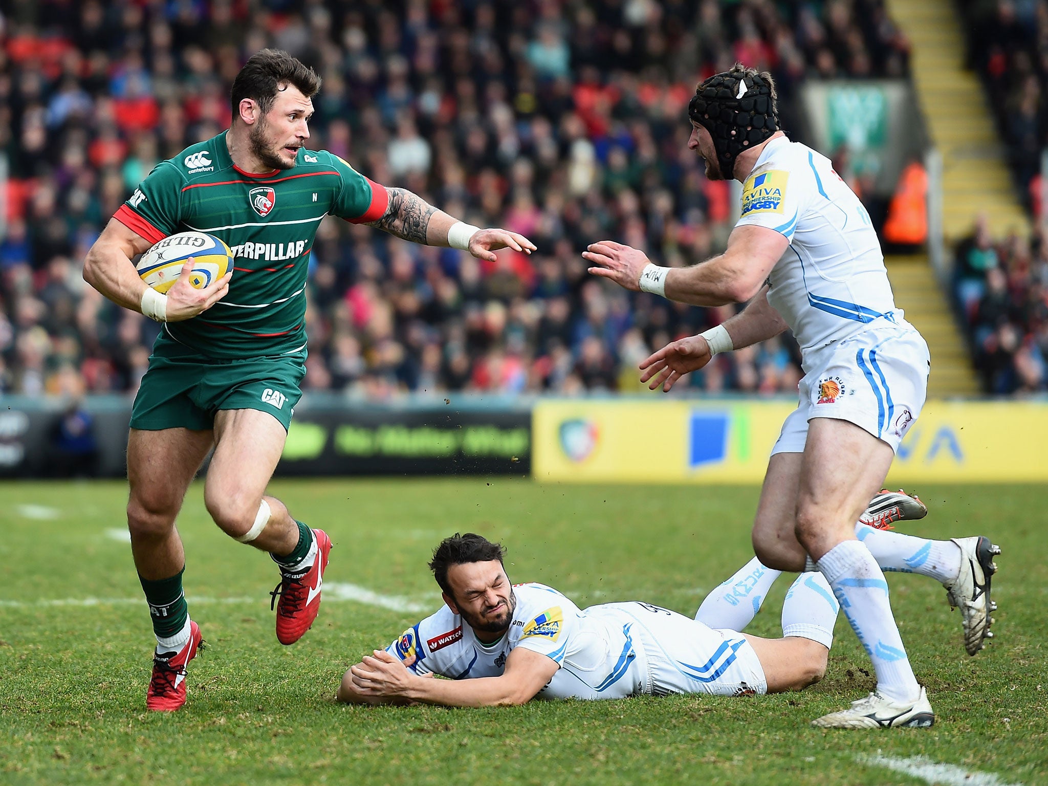 Adam Thompstone evades the tackles of Phil Dollman and Matt Jess