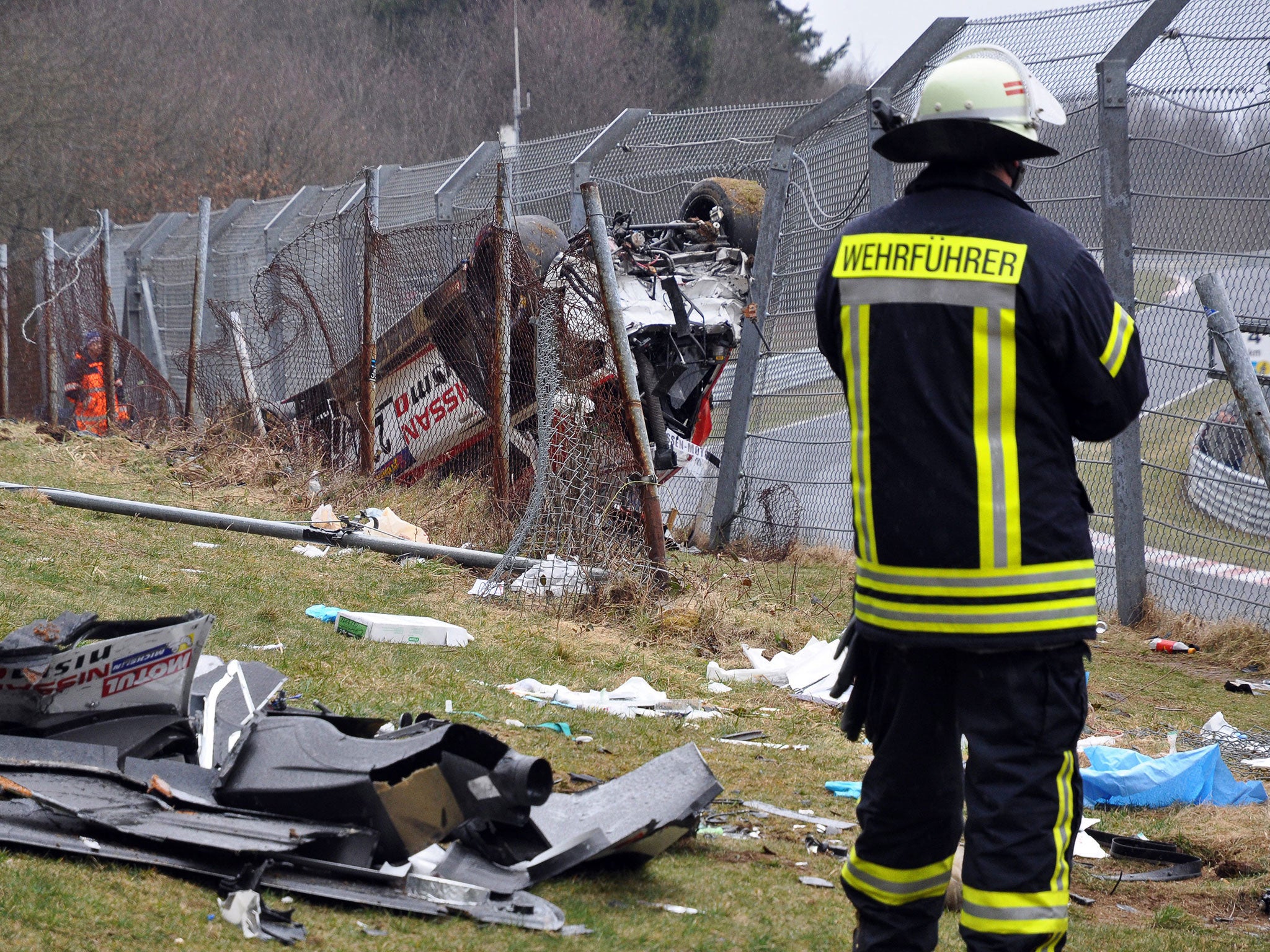 Mardenborough's car lies on the spectator side of the catch-fence