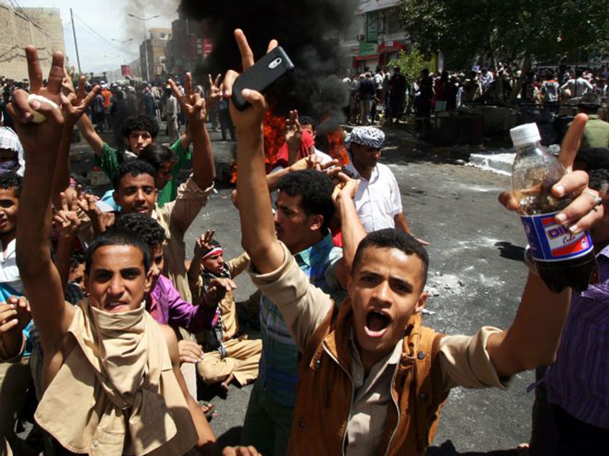 Crowds in Taiz, Yemen react to a Houthi rebel takeover in parts of the city