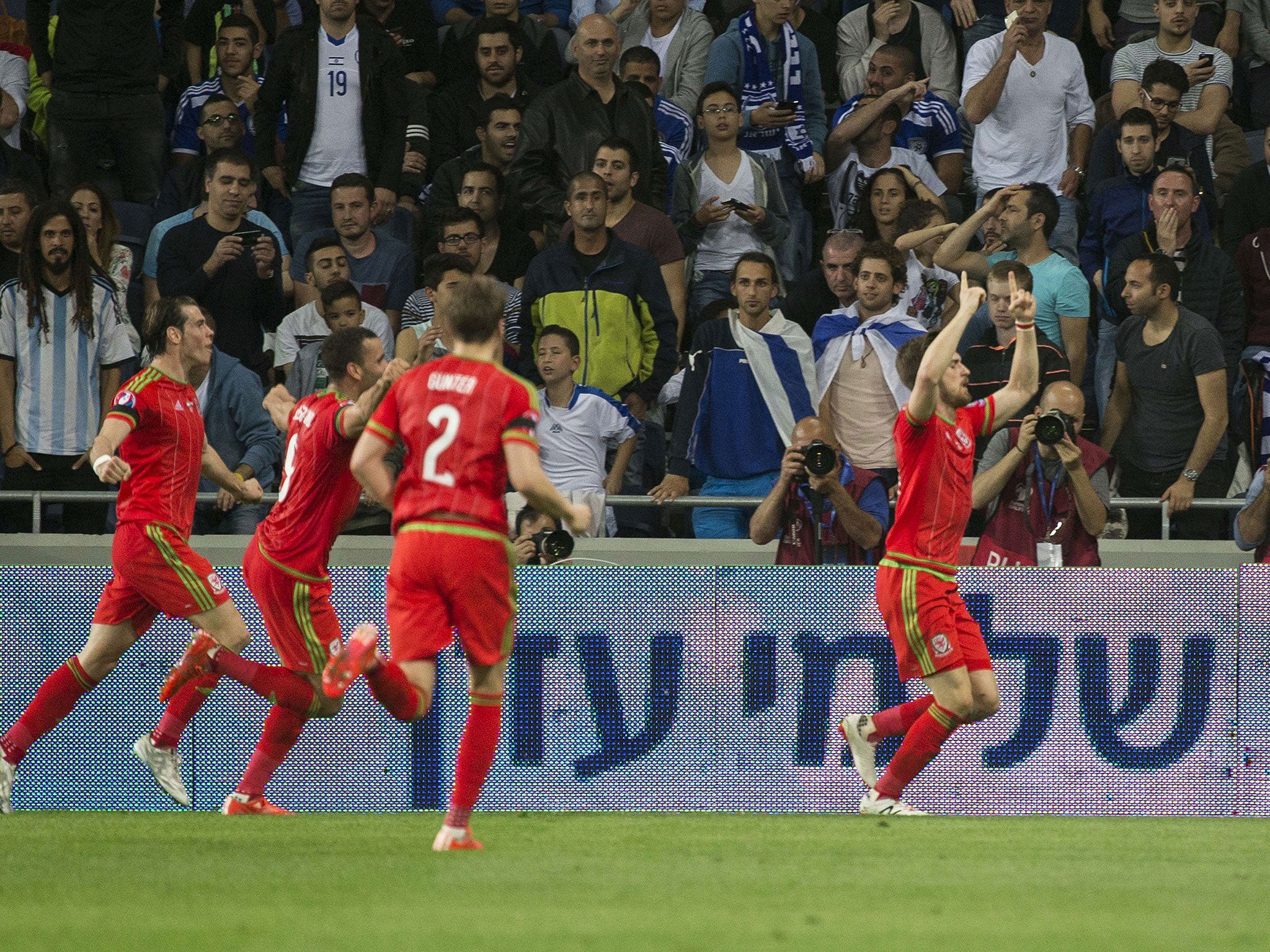 Aaron Ramsey celebrates scoring England's opener