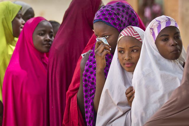 Women cast their vote in Daura, the home town of opposition candidate Muhammadu Buhari