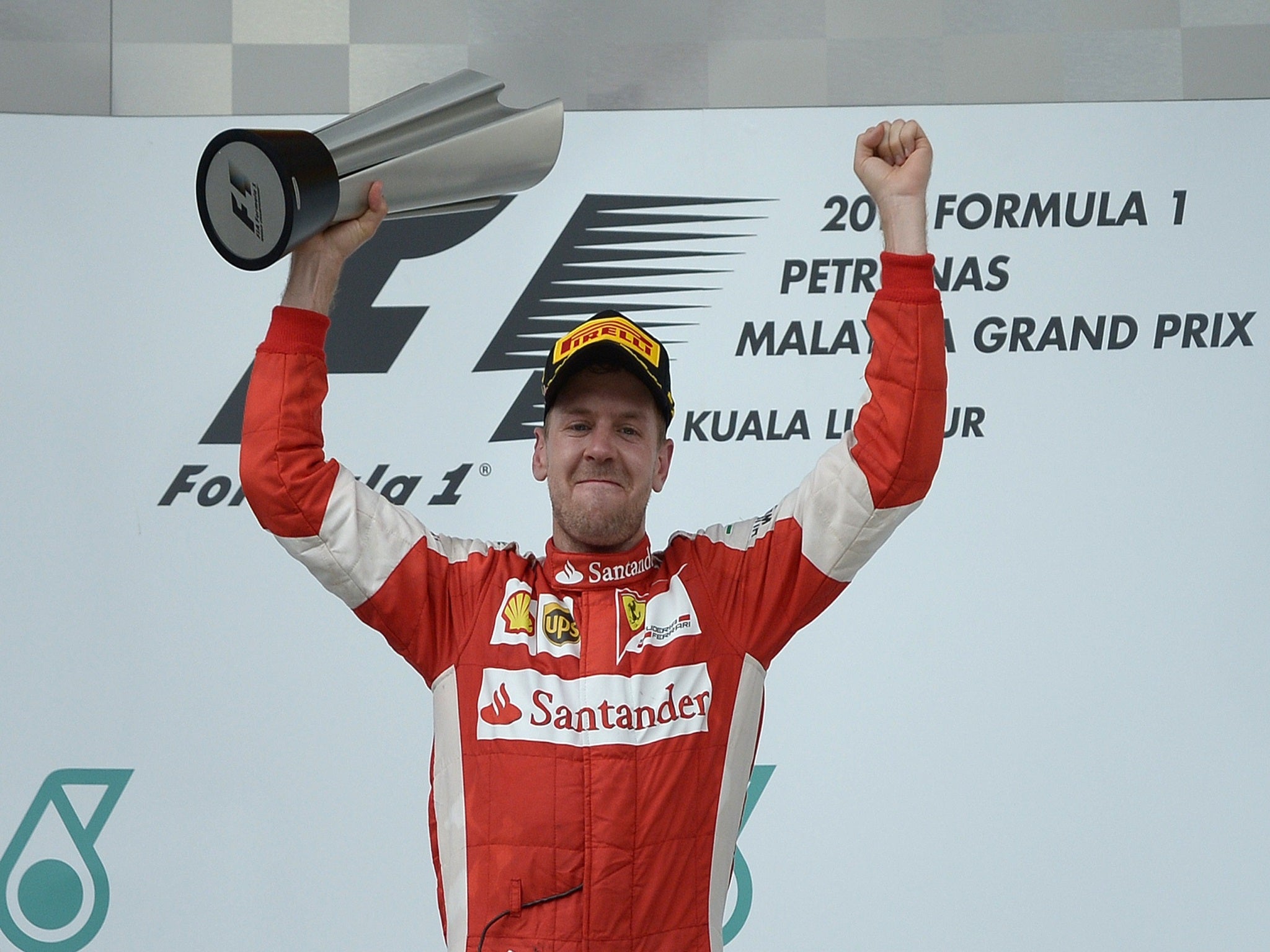 Sebastian Vettel lifts the Malaysian Grand Prix trophy
