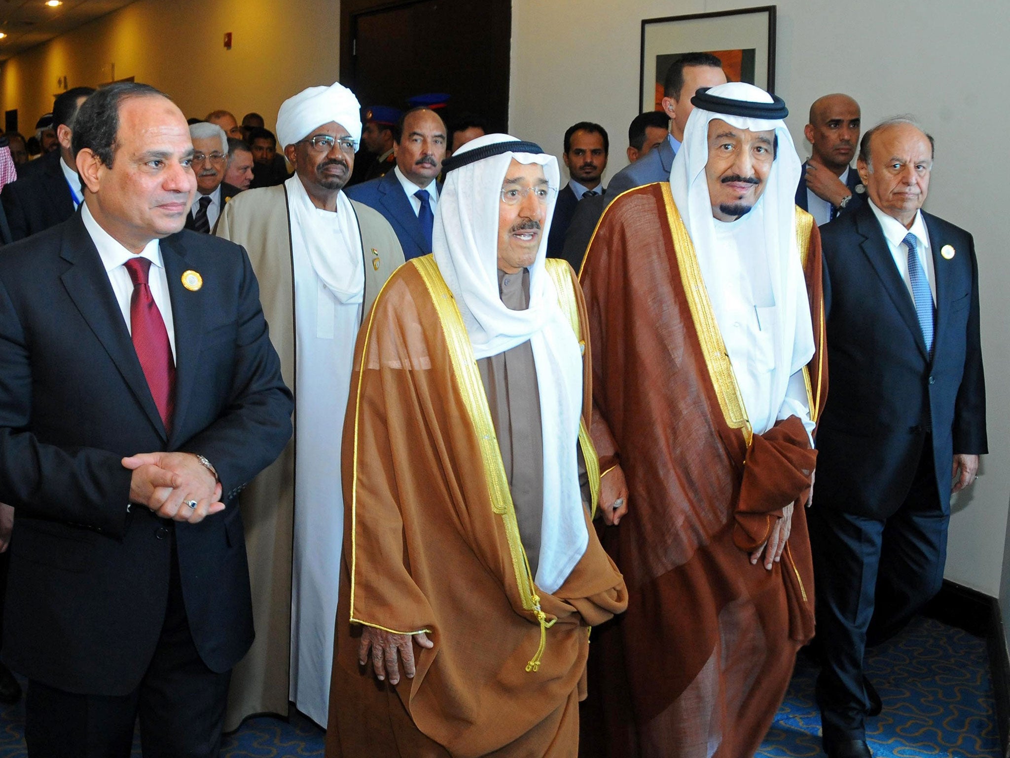 Arab League leaders including (from left to right): Egyptian President Abdel-Fattah el-Sisi, Sudanese President Omar al-Bashir, Kuwait's Emir Sheik Sabah Al-Ahmad Al-Jaber Al-Sabah, Saudi King Salman, second and Yemeni President Abdel Rabbo Mansour Hadi,