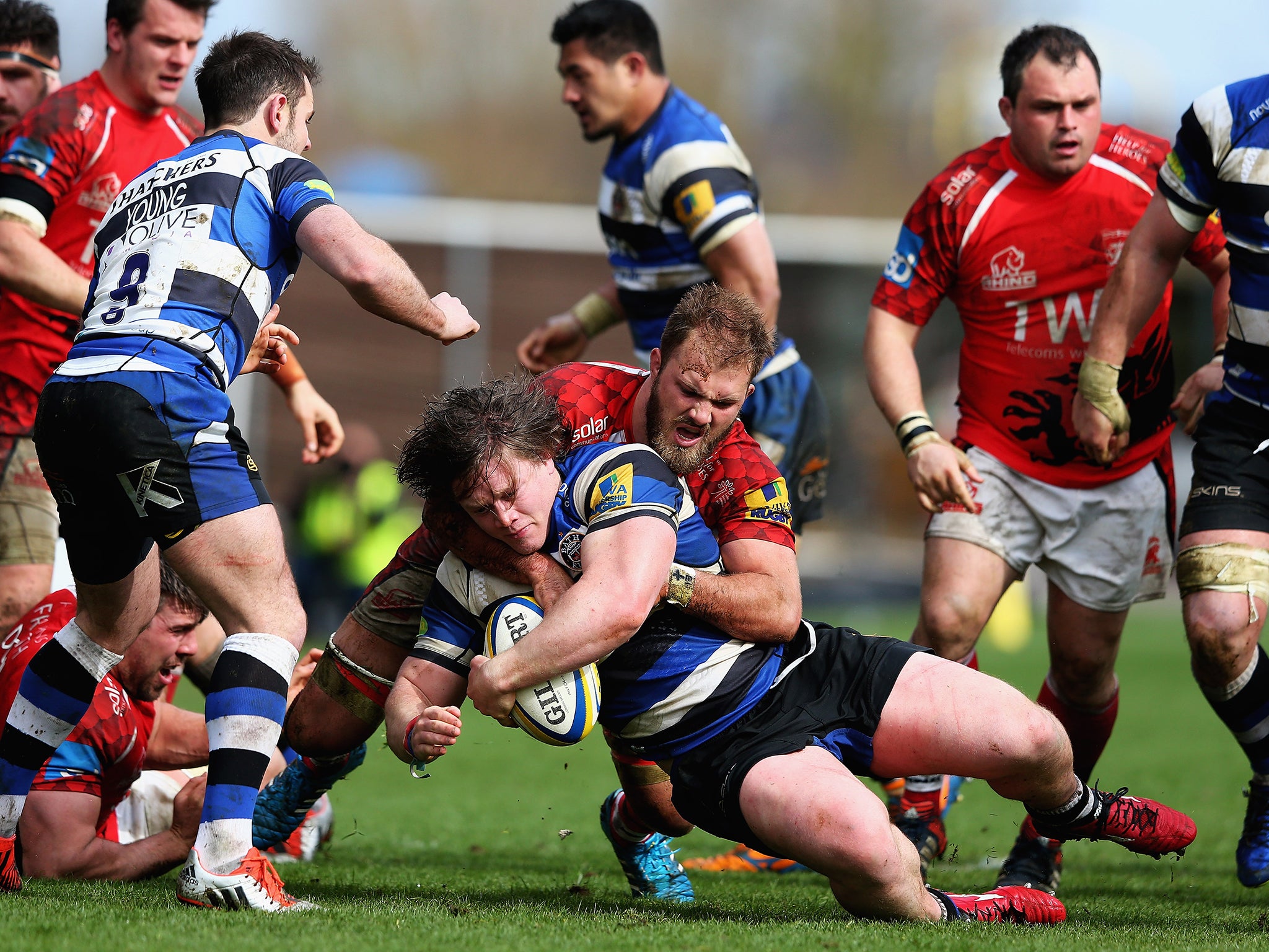Nick Auterac of Bath is tackled by Lachlan McCaffrey of London Welsh