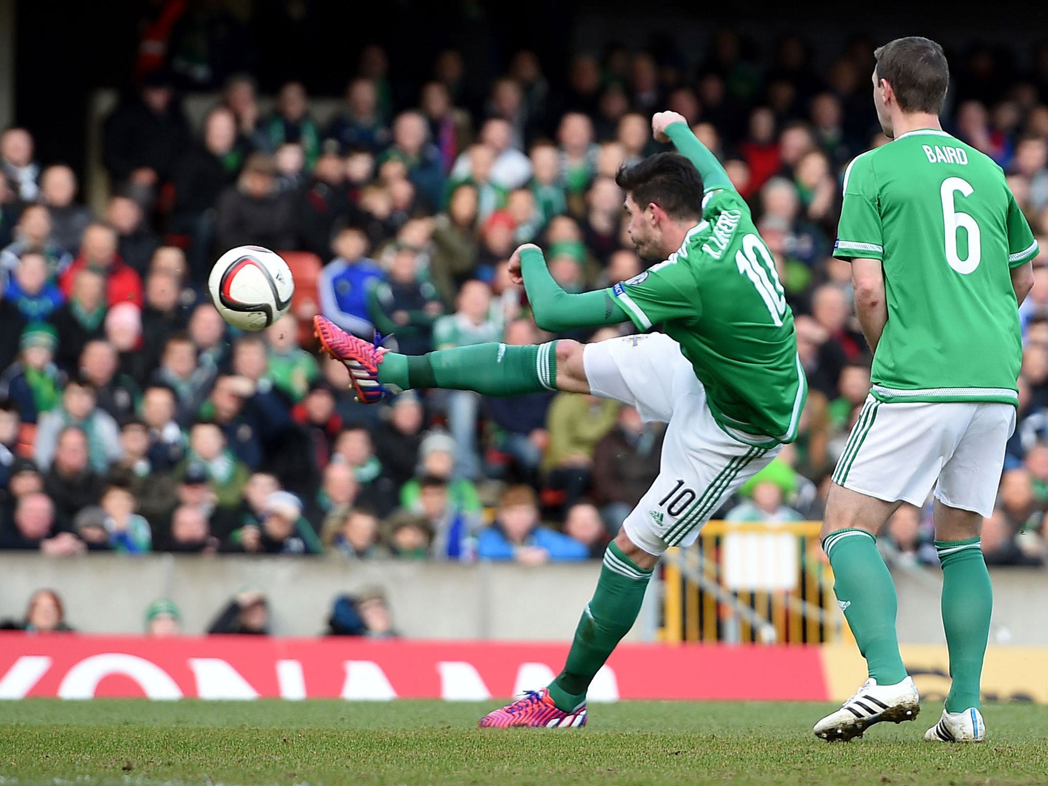 Kyle Lafferty volleys home the first of his two goals for Northern Ireland