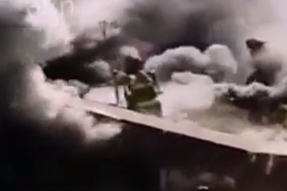 Firefighter in critical condition after falling through roof while ...