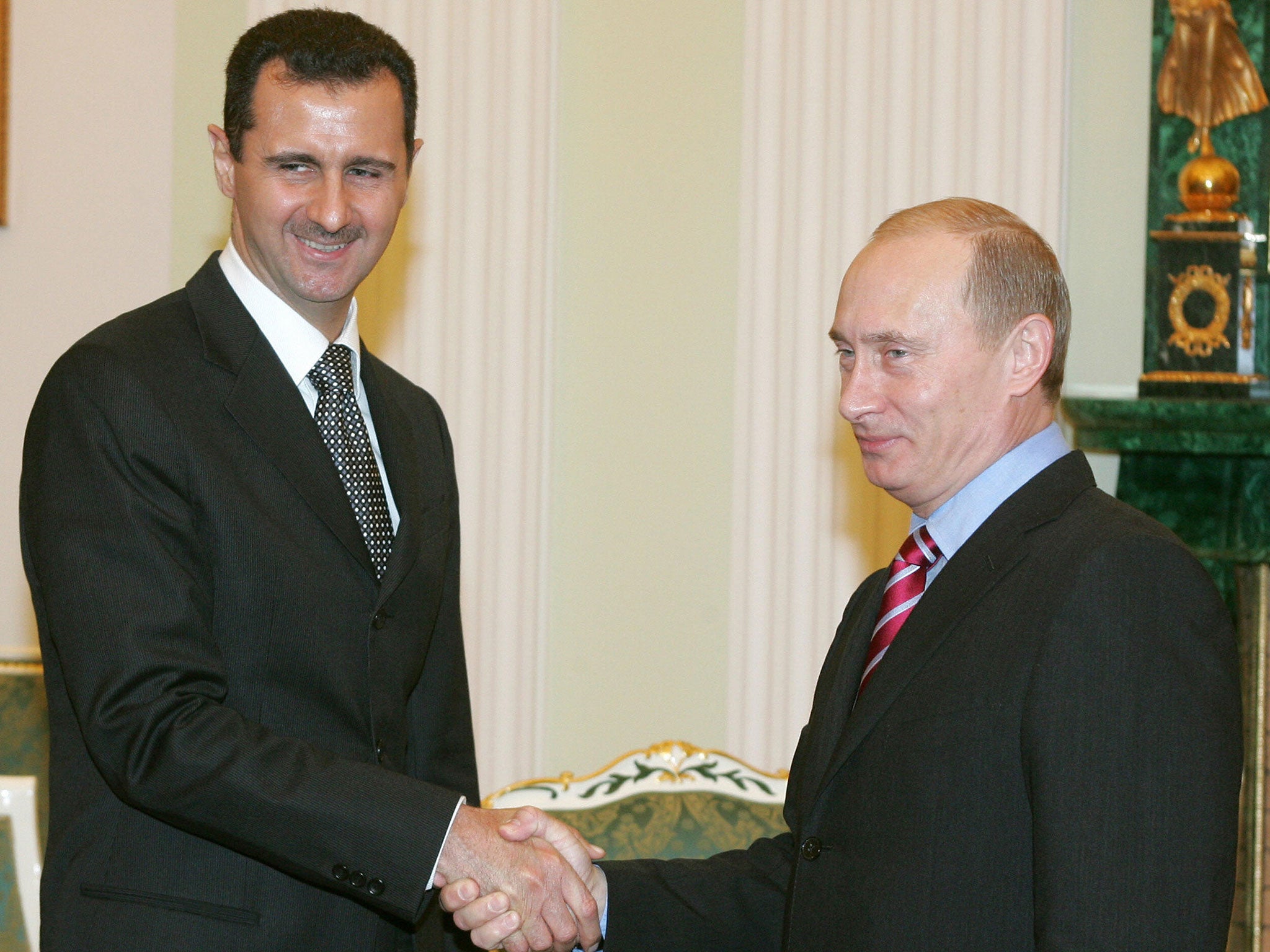Vladimir Putin has defended arming Bashar al-Assad