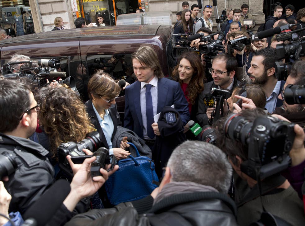 Raffaele Sollecito, centre, talks to the media as he leaves after a press conference in Rome on Monday