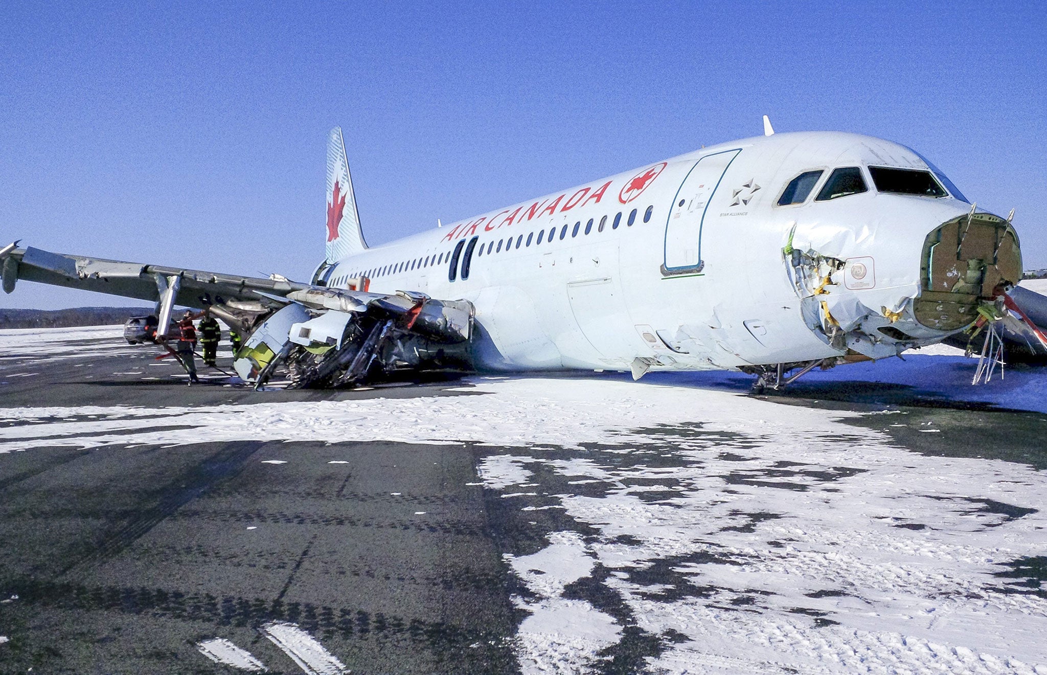 The Air Canada Airbus A320 which slid off the runway following a hard landing in poor weather conditions in Halifax, Nova Scotia