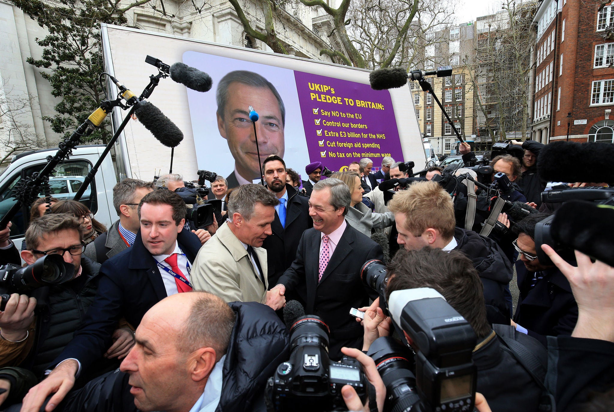 Nigel Farage smiles for lots of cameras as he launches his party's election campaign today (PA)