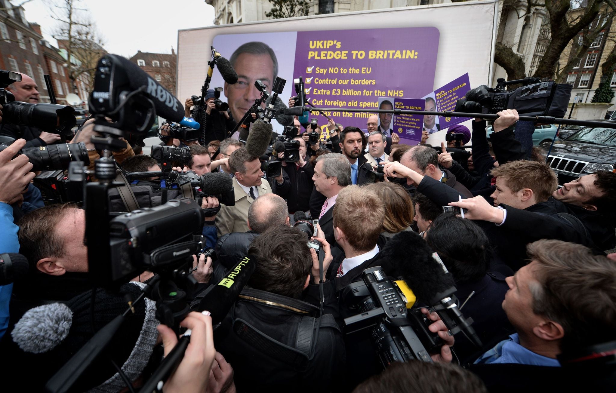 Nigel Farage was at the centre of an enormous scrum as he launched his election campaign today (PA)