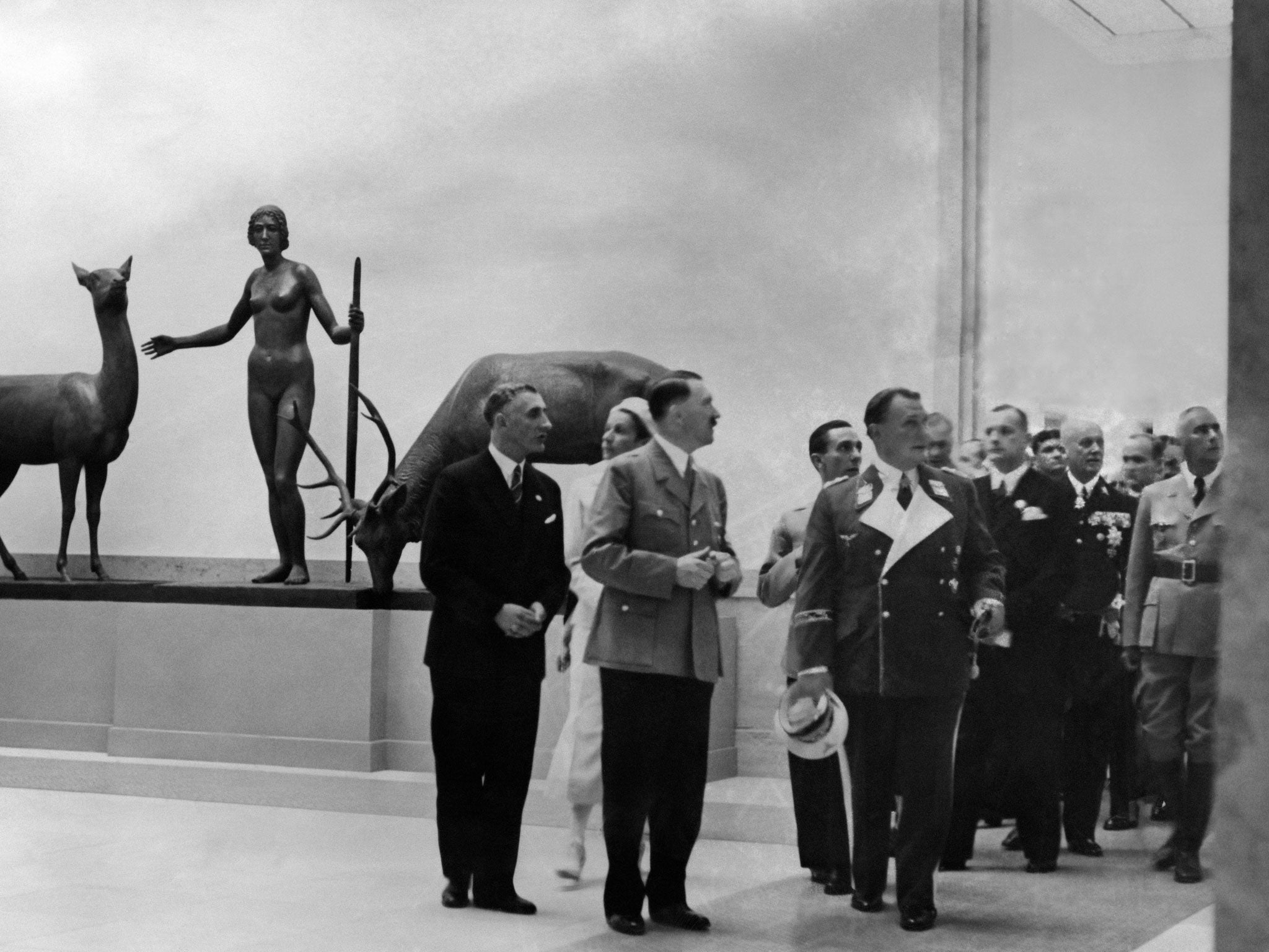 Nazi military dignitaries visiting an art exhibition during the opening ceremony of the 'House for German Art' in 1937