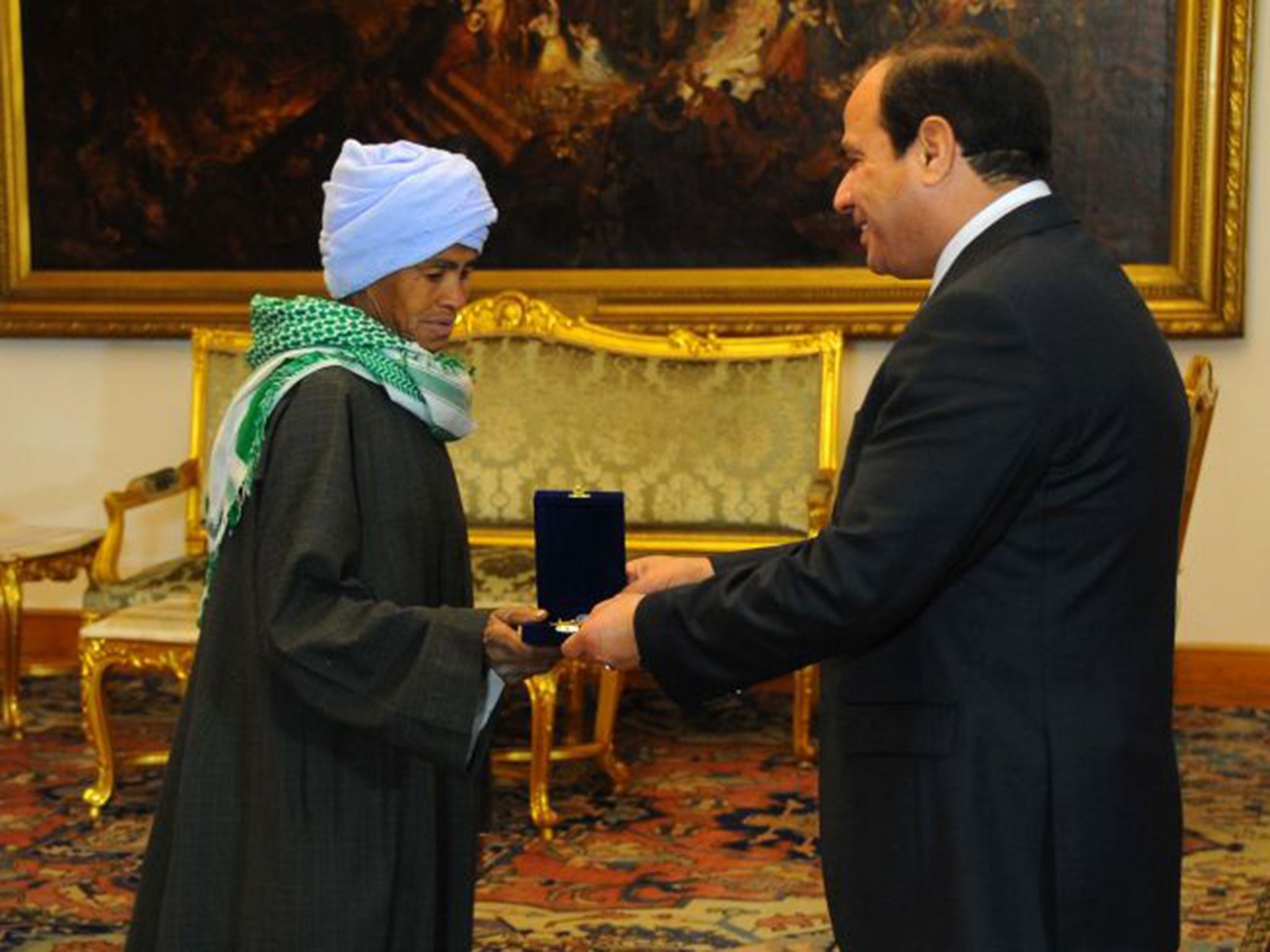 Sisi Abu Dooah, single mother (pictured here with Egyptian President Abdel Fattah al-Sisi)