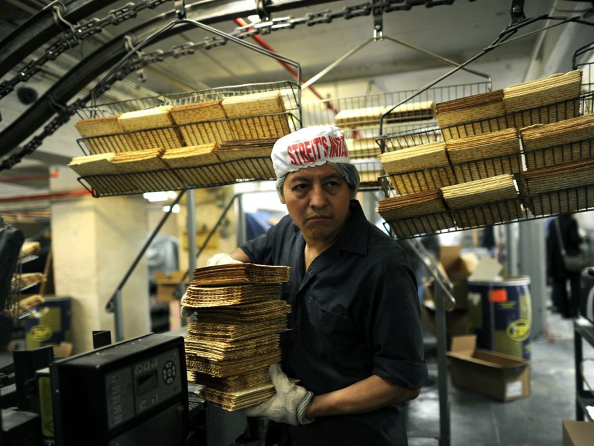Unleavened matzah being produced in a factory ahead of Passover