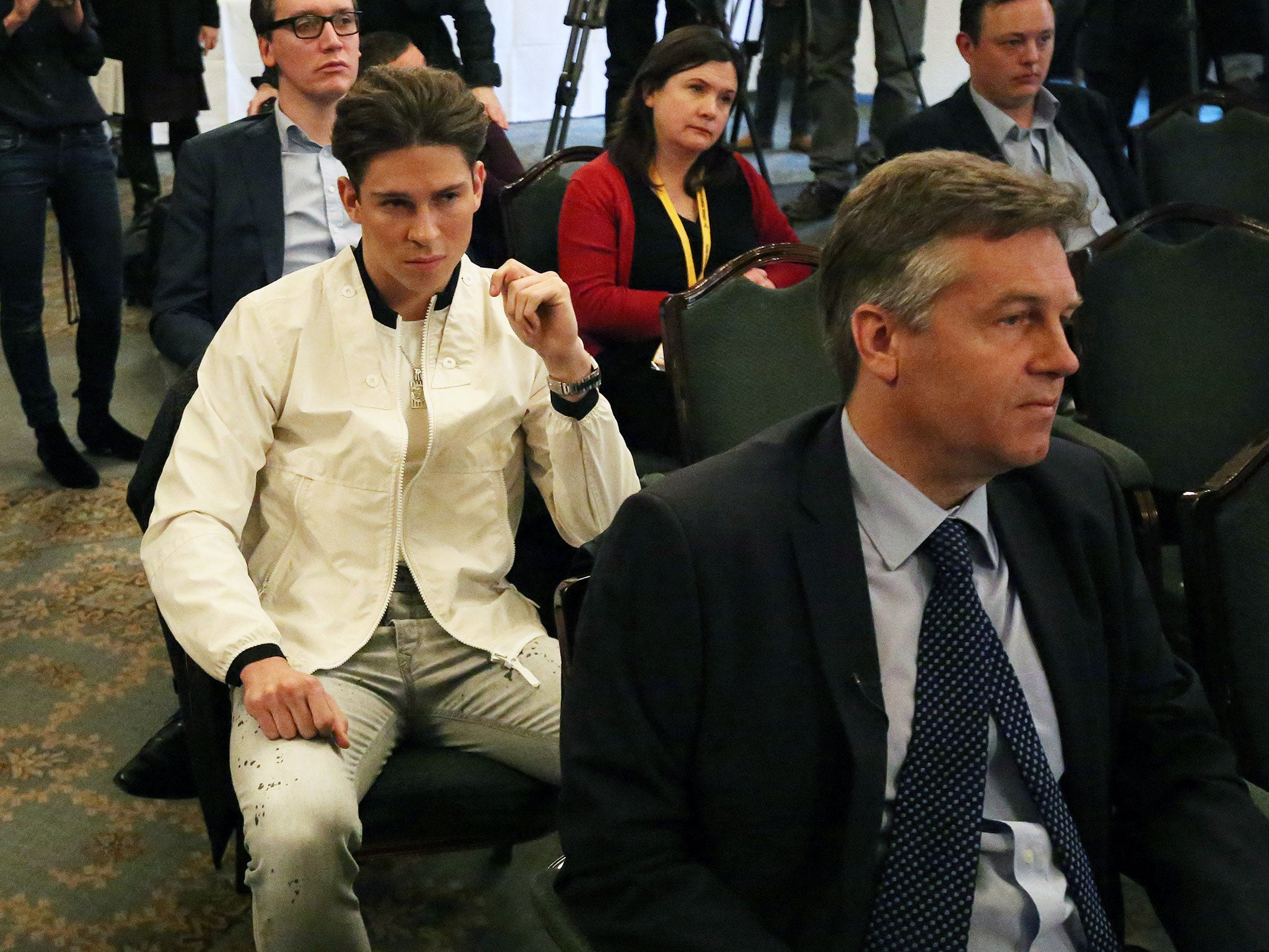 Joey Essex listens during a press conference with Liberal Democrat party leader Nick Clegg in Westminster