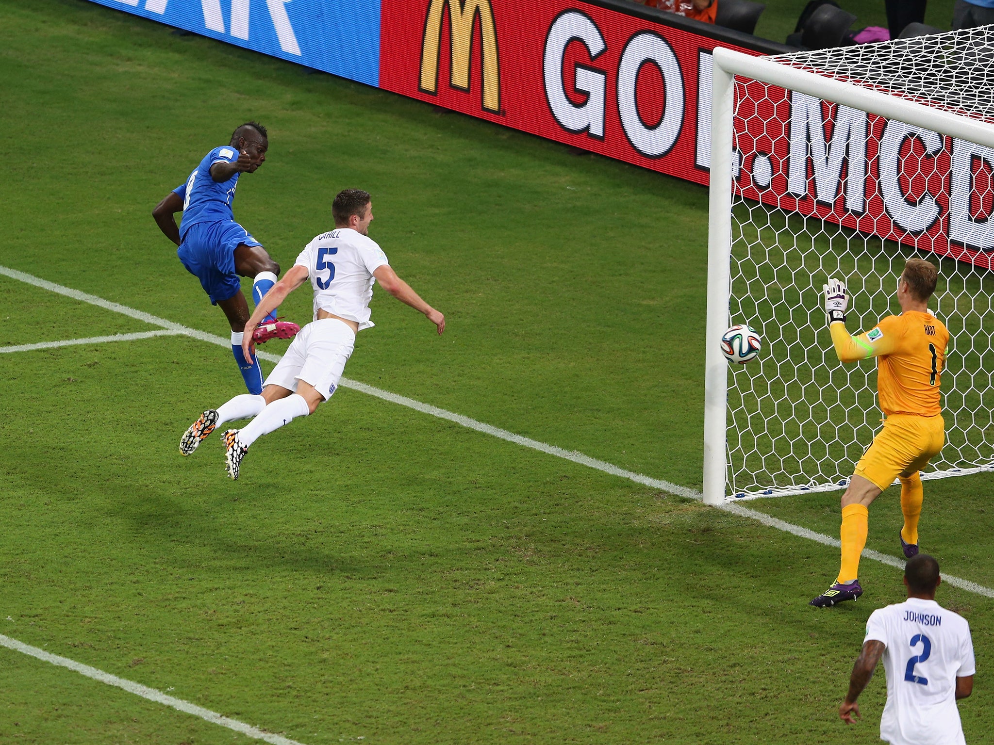 Mario Balotelli scores past England at the World Cup
