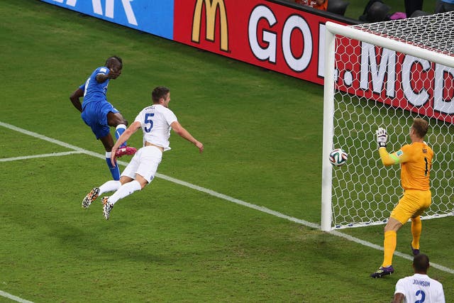Mario Balotelli scores past England at the World Cup