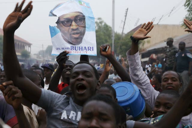 Supporters of Muhammadu Buhari and his All Progressive Congress party (APC) celebrate in Kano after Buhari swept to victory in Nigeria’s presidential elections