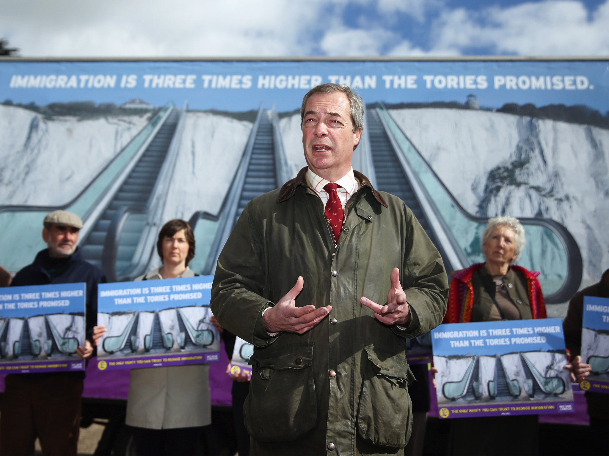 Nigel Farage unveiled Ukip’s latest campaign poster in Dover on Tuesday, saying David Cameron was ‘wilfully dishonest’ on immigration