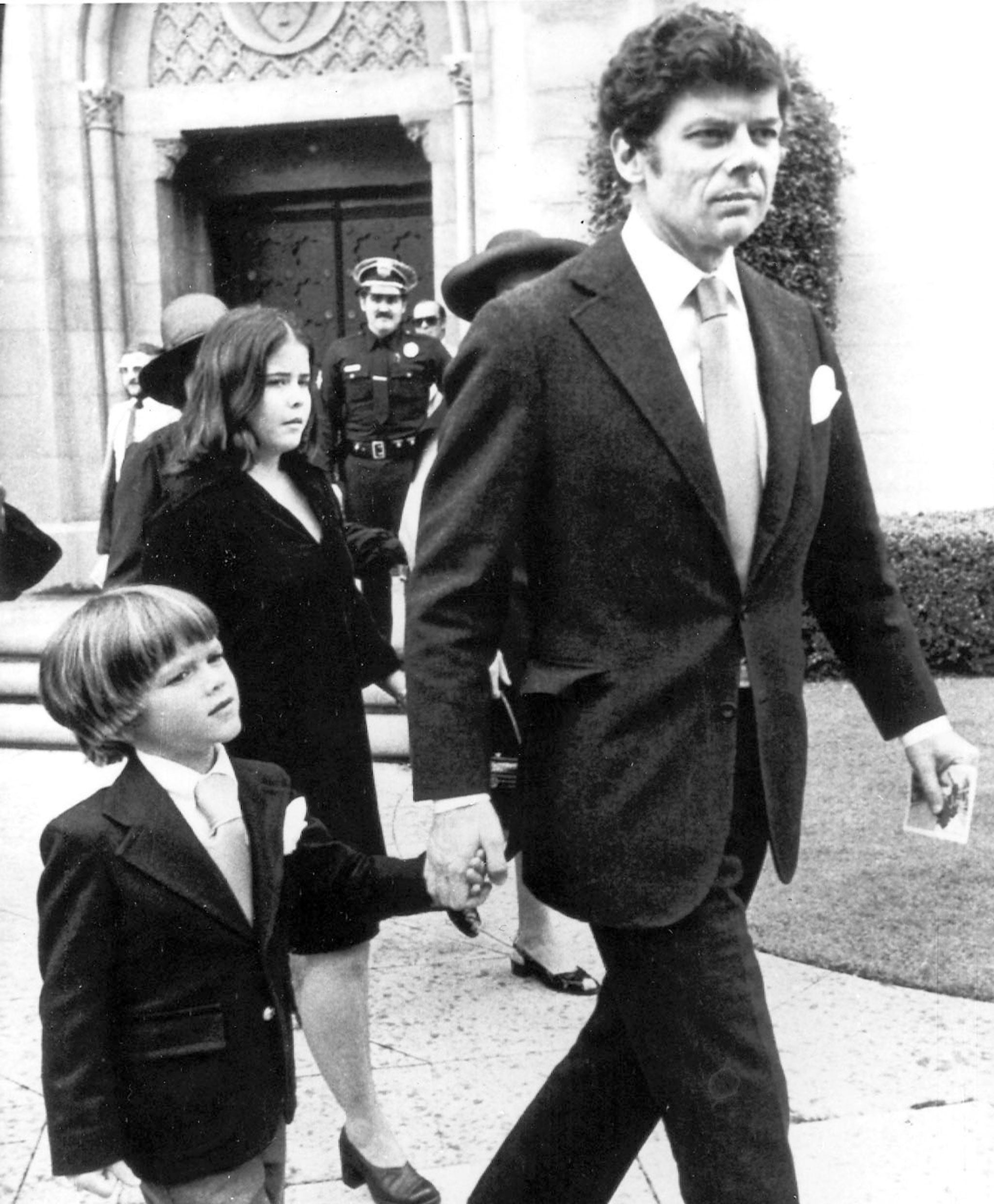 Andrew Getty with his father Gordon in 1976, at the memorial service for his grandfather J Paul Getty