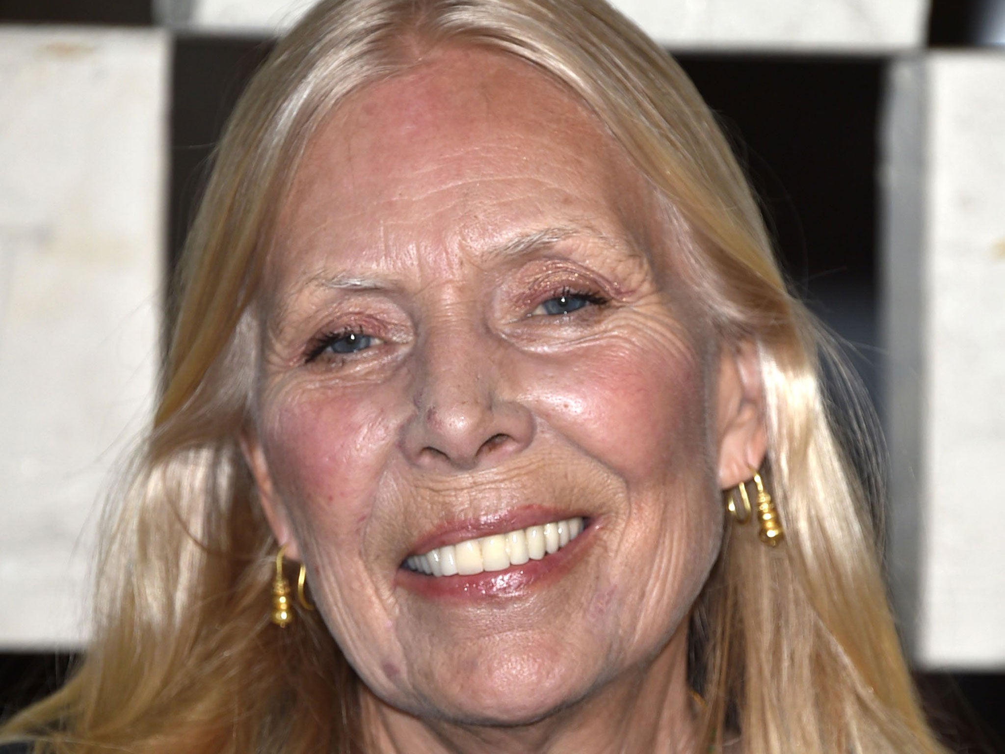 A statement on Joni Mitchell's website said it was awaiting word on her condition