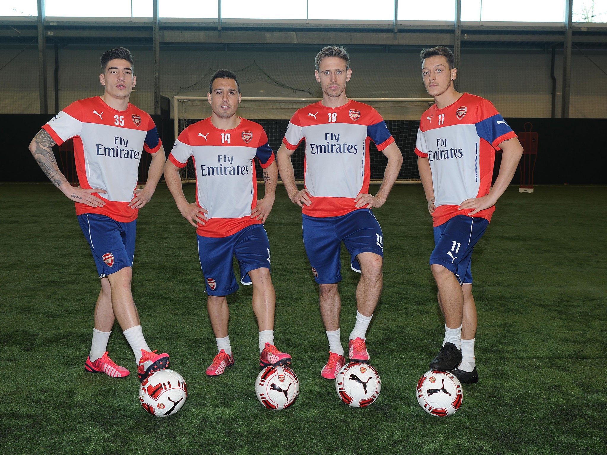 Arsenal players Hector Bellerin, Santi Cazorla, Nacho Monreal and Mesut Ozil and their new Puma football