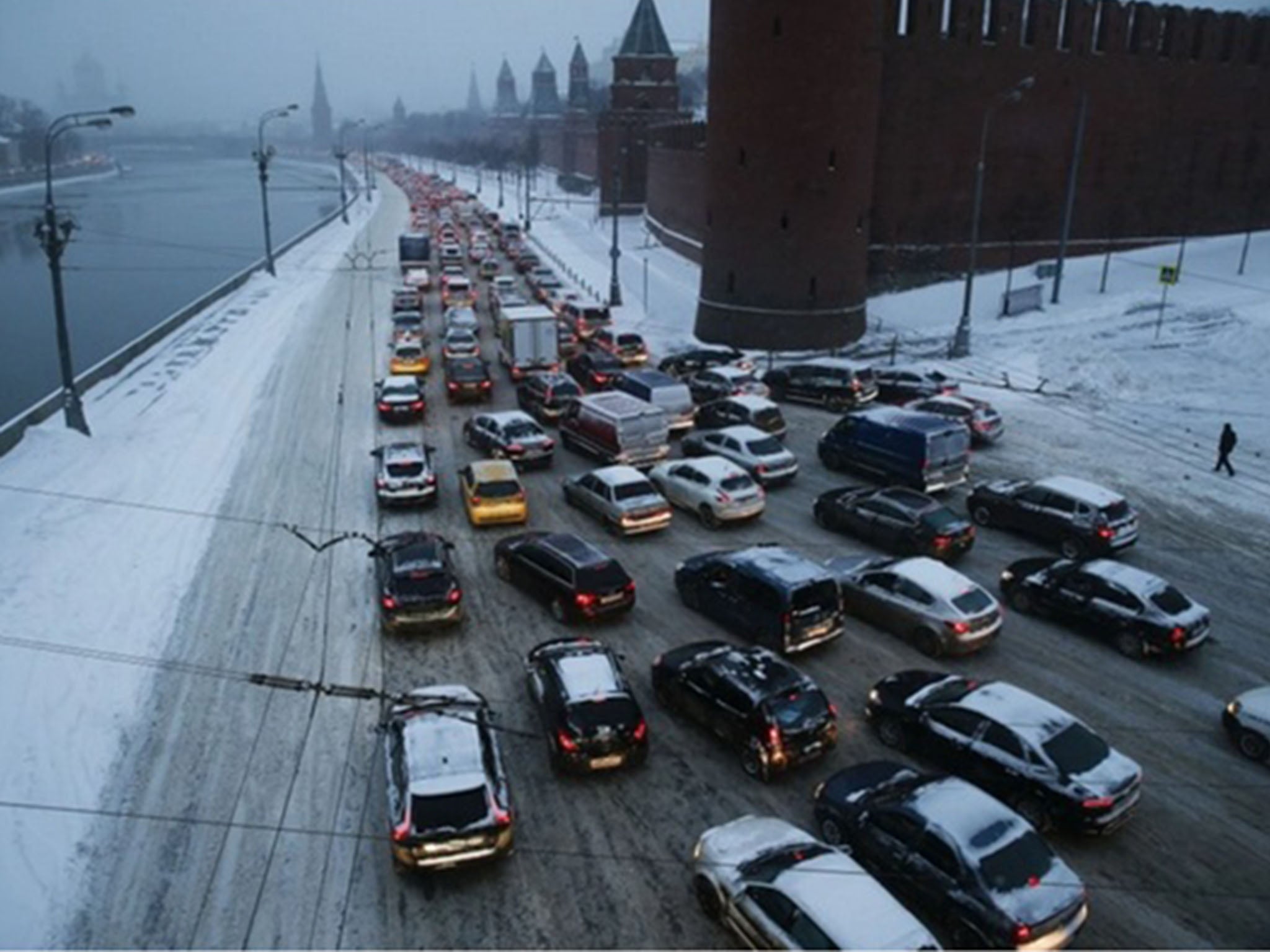 Cars are stuck in a congested traffic on both banks of the Moskva River outside the Kremlin, during heavy snowfall in downtown Moscow in December.