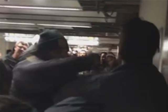 A TTC officer appears to punch a man in the video